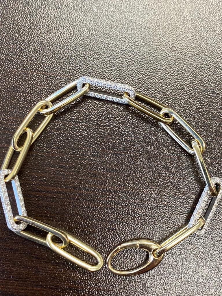 White and yellow gold paperclip bracelet set in 14K. The bracelet weighs 2.07 carats. The stones are G-H, the clarity is SI1-SI2. The bracelet is 7 inches in length.