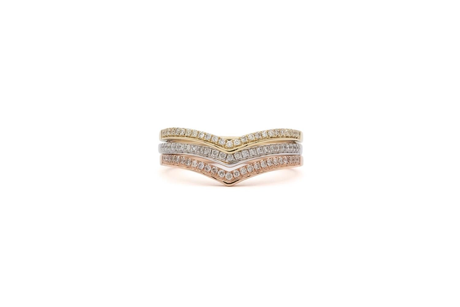 We are pleased to offer these Brand New 14k White Yellow & Rose Gold Diamond Chevron Stacking Fashion Rings. They feature 0.30ctw G/VS Round brilliant Cut Diamonds set in 14k gold. They are size 6.5 US and measures 1.50mm wide. The rings are brand