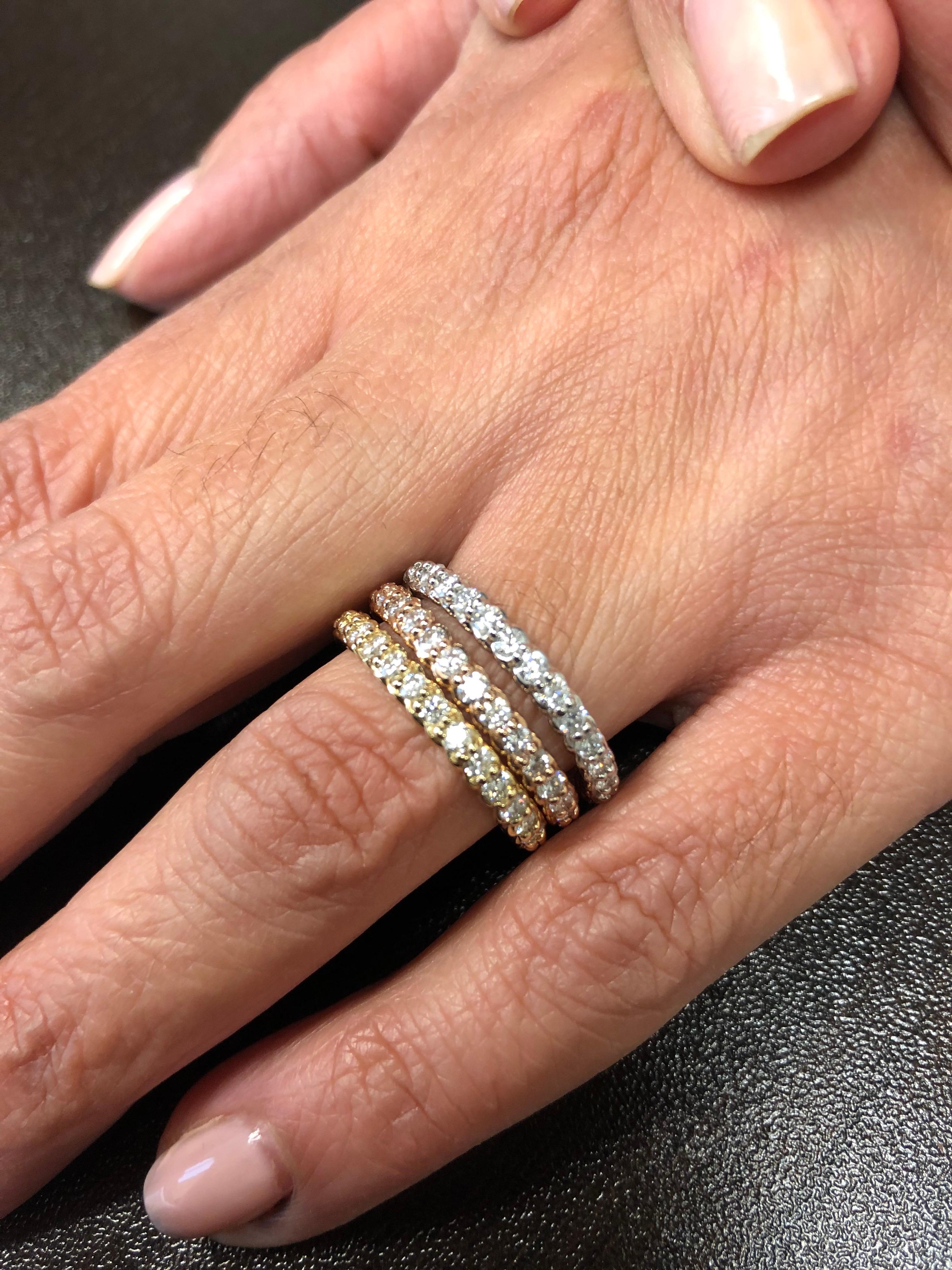 14K stackable tricolor rope eternity rings sold as a set. Each ring weighs a total of 1.30 carats. The diamonds set weigh 0.05 carats each. The color of the stones are G-H, the clarity is SI1. The rings are a size a size 7.