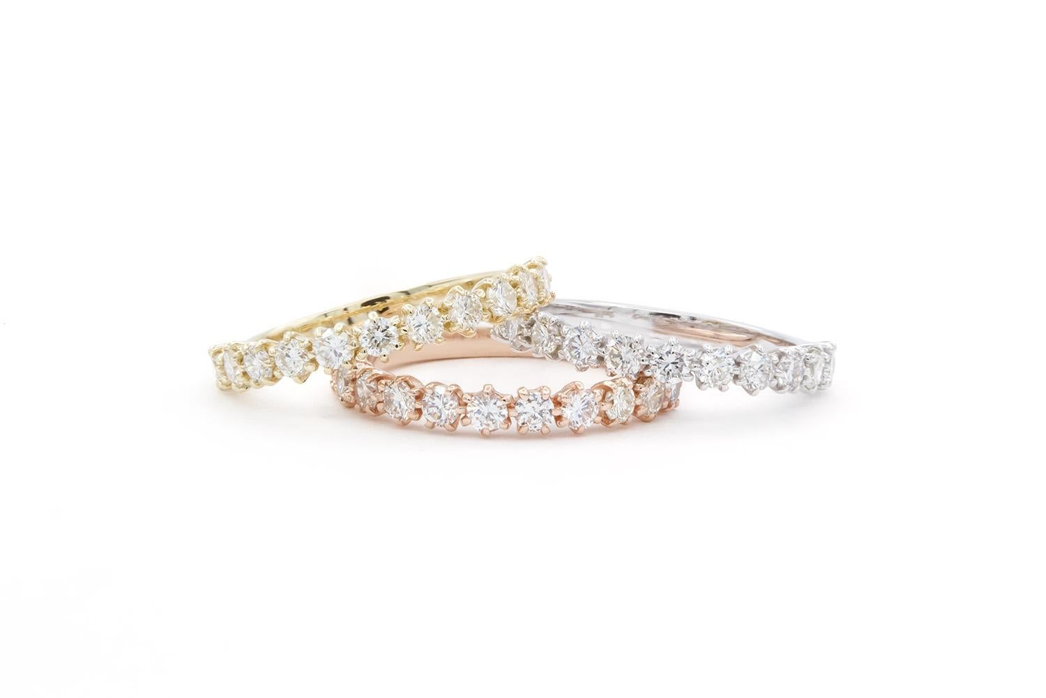 We are pleased to offer these 14k White Yellow & Rose Gold Diamond Stacking Fashion Rings. They feature 1.55ctw G-H/VS-SI Round Brilliant Cut Diamonds set in 14k gold. They are size 5.25 US and measures 3mm wide at the diamonds and 1.75 below the
