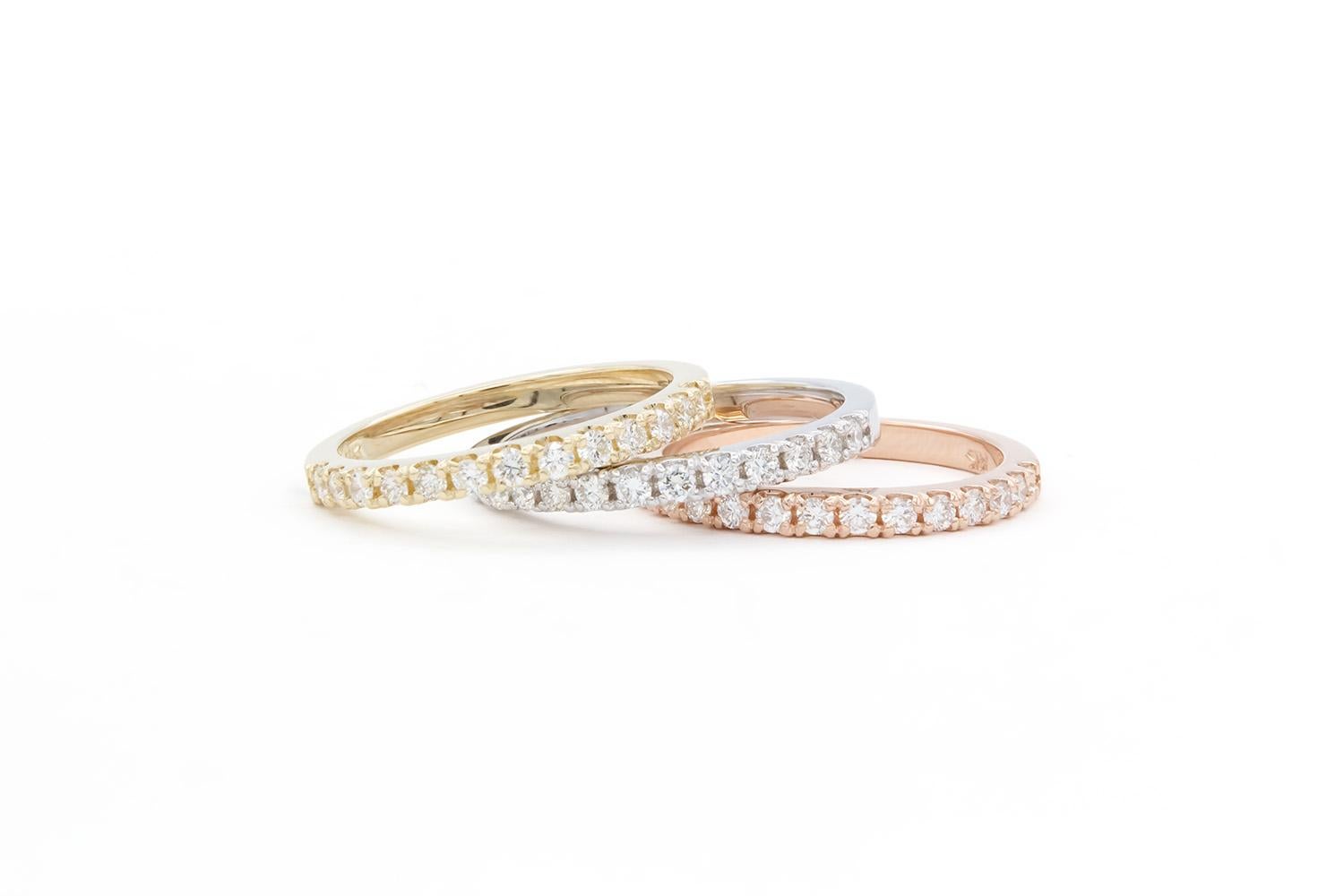 We are pleased to offer these Brand New 14k White Yellow & Rose Gold U Pave Diamond Stacking Fashion Rings. They feature 0.80ctw F-G/VS round brilliant cut diamonds set in these 14k gold stacking rings. They are size 6 US and measures 2mm wide. The