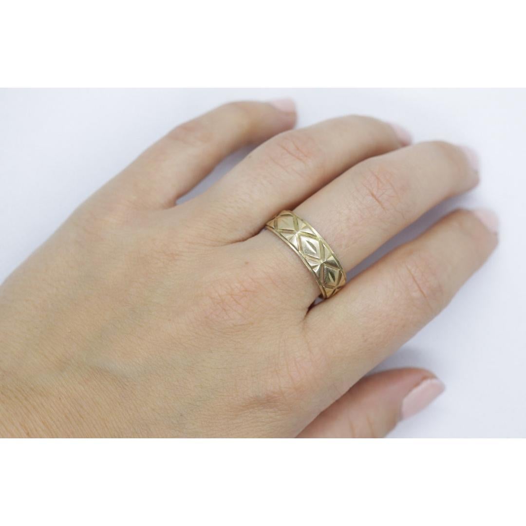 Vintage from the 1960s
Size: 10.75 US

Materials: Gold

Very Rare Heavy band. Made by Wed-LOK and out of 14k yellow gold. Hallmarked appropriately.

Condition: Has not been polished. Has some small scratches.

Details:
7mm wide band
5.6grams total