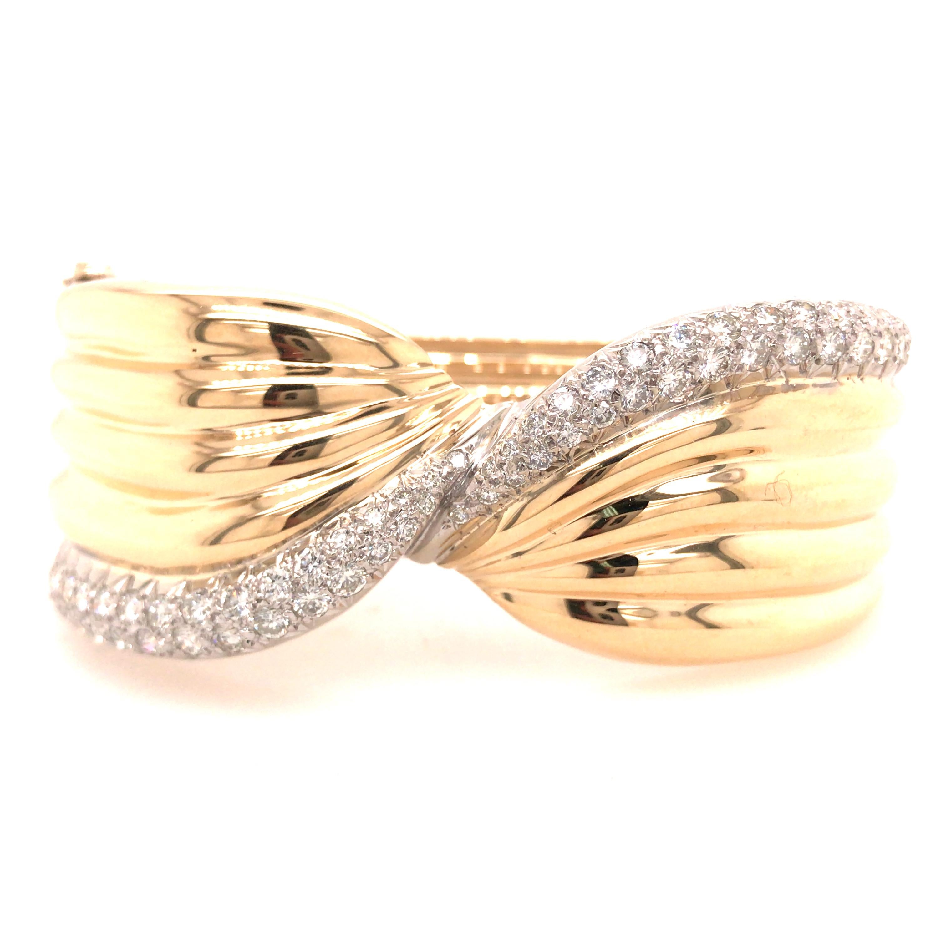 Wide Diamond Twist Cuff in 14K Two-Tone Gold.  Round Brilliant Cut Diamonds weighing approximately 4.32 carat total weight, G-H in color and VS in clarity are expertly set.  The Cuff measures 6 3/4 inch inner circumference and 1 inch in width at the