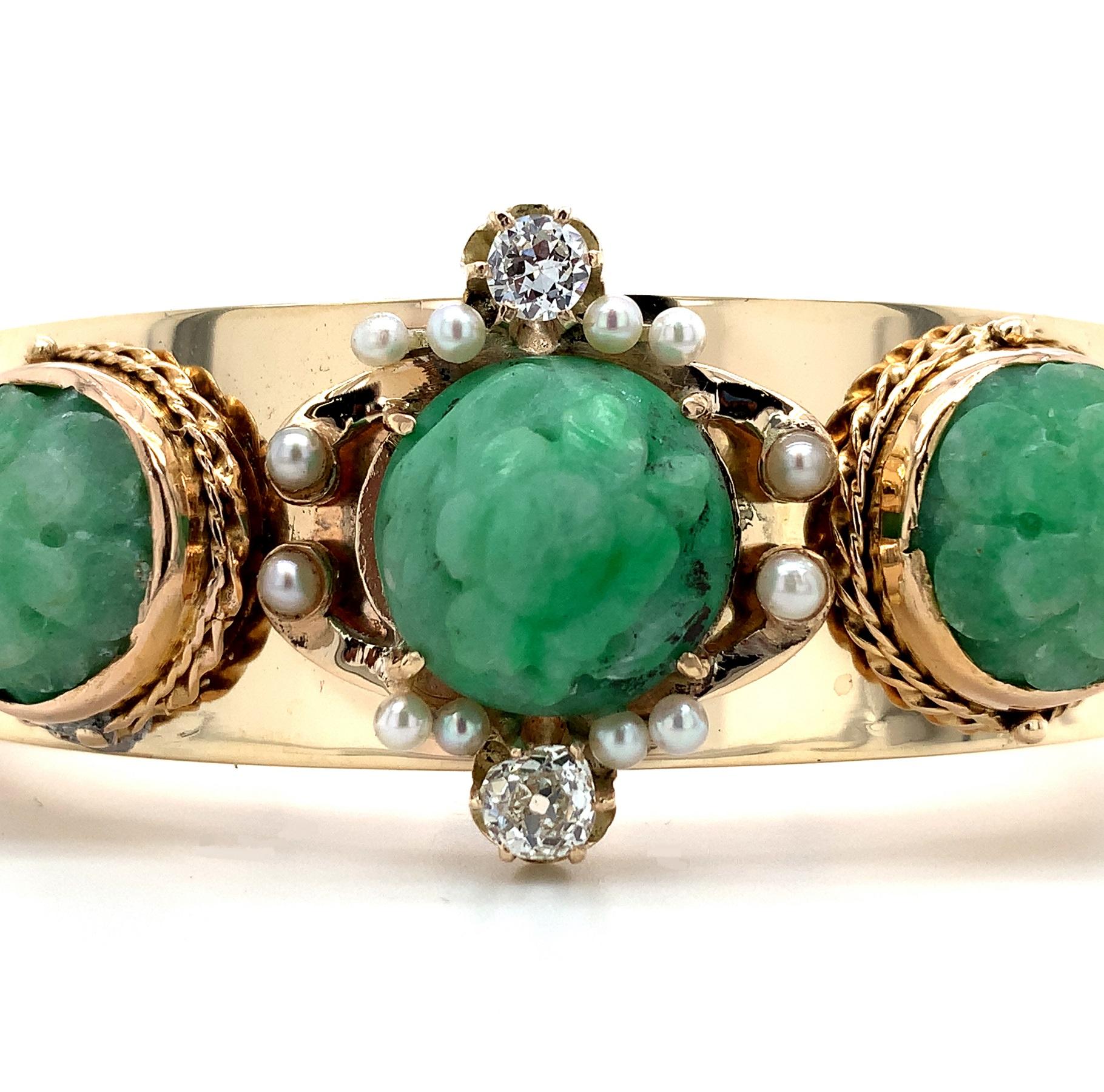 14K yellow gold solid heavy bangle bracelet with applied jade, diamonds, and pearls. The bangle bracelet interior measures 2 1/4