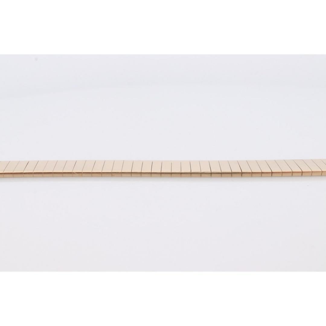 Vintage from the 1980s
Materials: Gold

Bracelet width: 8 Millimeters; Bracelet length: 7.25 Inches

Beautiful High quality wide Bracelet. Made by an Italian designer. 14k Yellow Gold tests appropriately. Slide lock with safety pin.

Omega Specialty