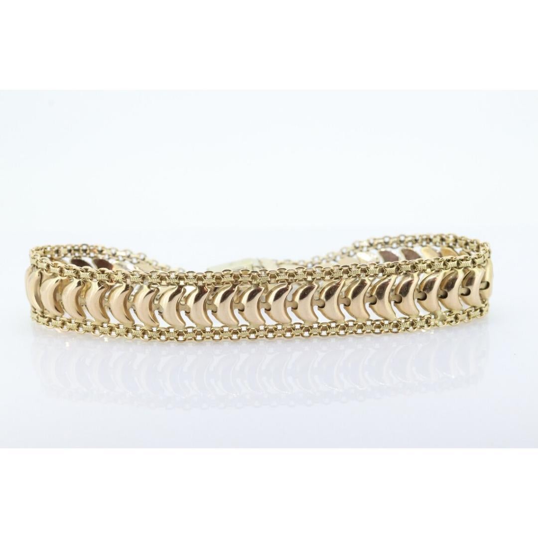 Vintage from the 1980s

Materials: Gold

Beautiful High Polish wide Bismark Chain Bracelet. Made by an Italian designer. 14k Yellow Gold tests appropriately. Slide lock with safety pins.

Condition: Shows limited signs of use.

Details:
11mm