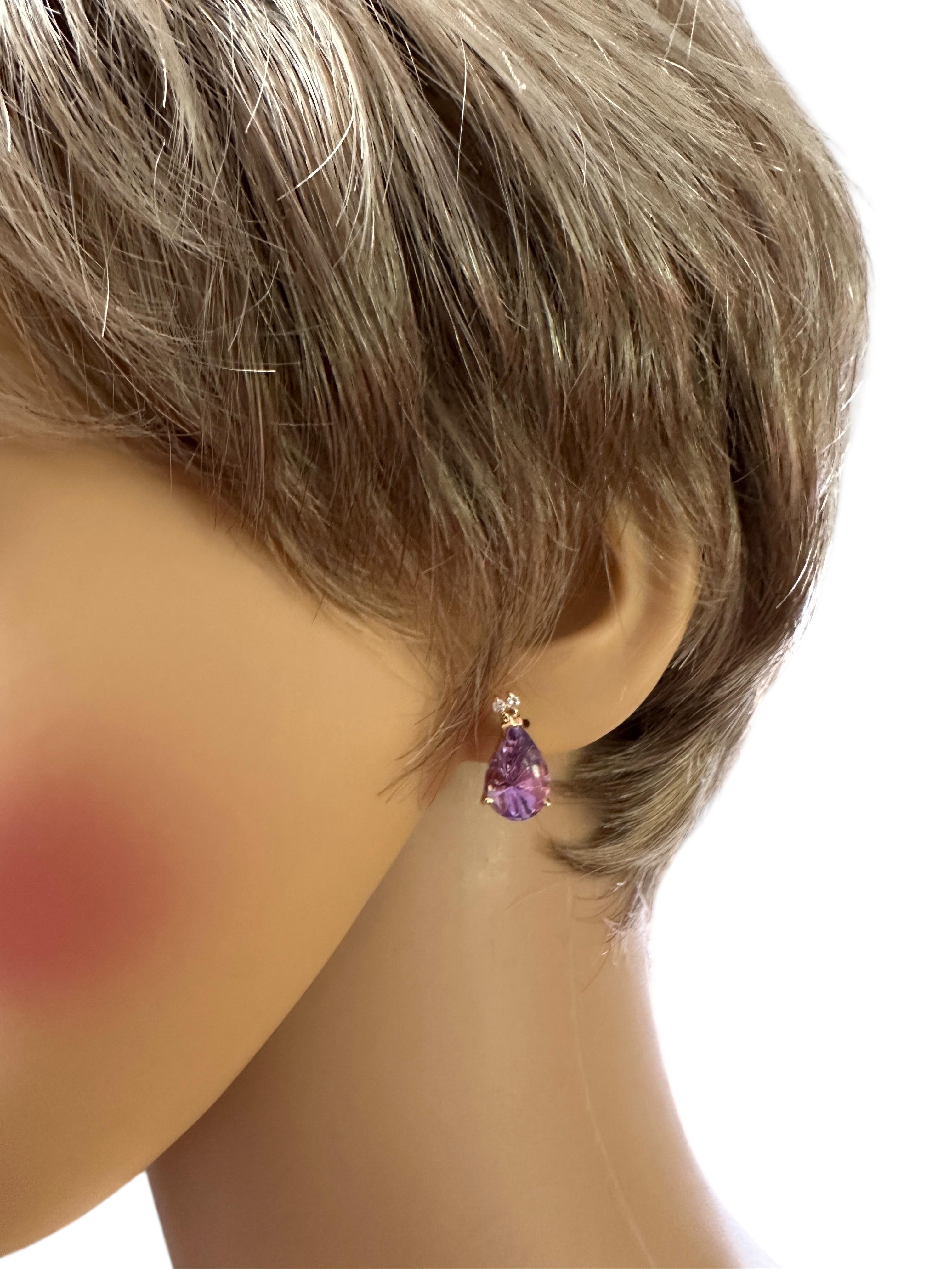 These earrings are really striking!  They are handmade and you can see it's unique and fabulous cut in the photos.  The lines on the Amethyst are part of the design. and they also have scallops on the upper side.  The mountings are custom made and