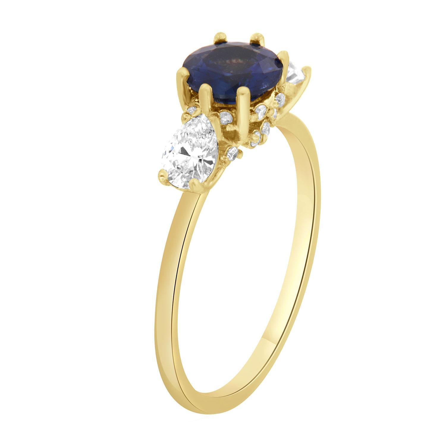 This petite ring is from our Vale collection is impressive in its Earthy & Organic appeal. It features a 0.96-carat round natural Sri-Lankan Sapphire set in six tiny prongs and flanked by two perfectly Pear-Shape diamonds in a total weight of 0.50.