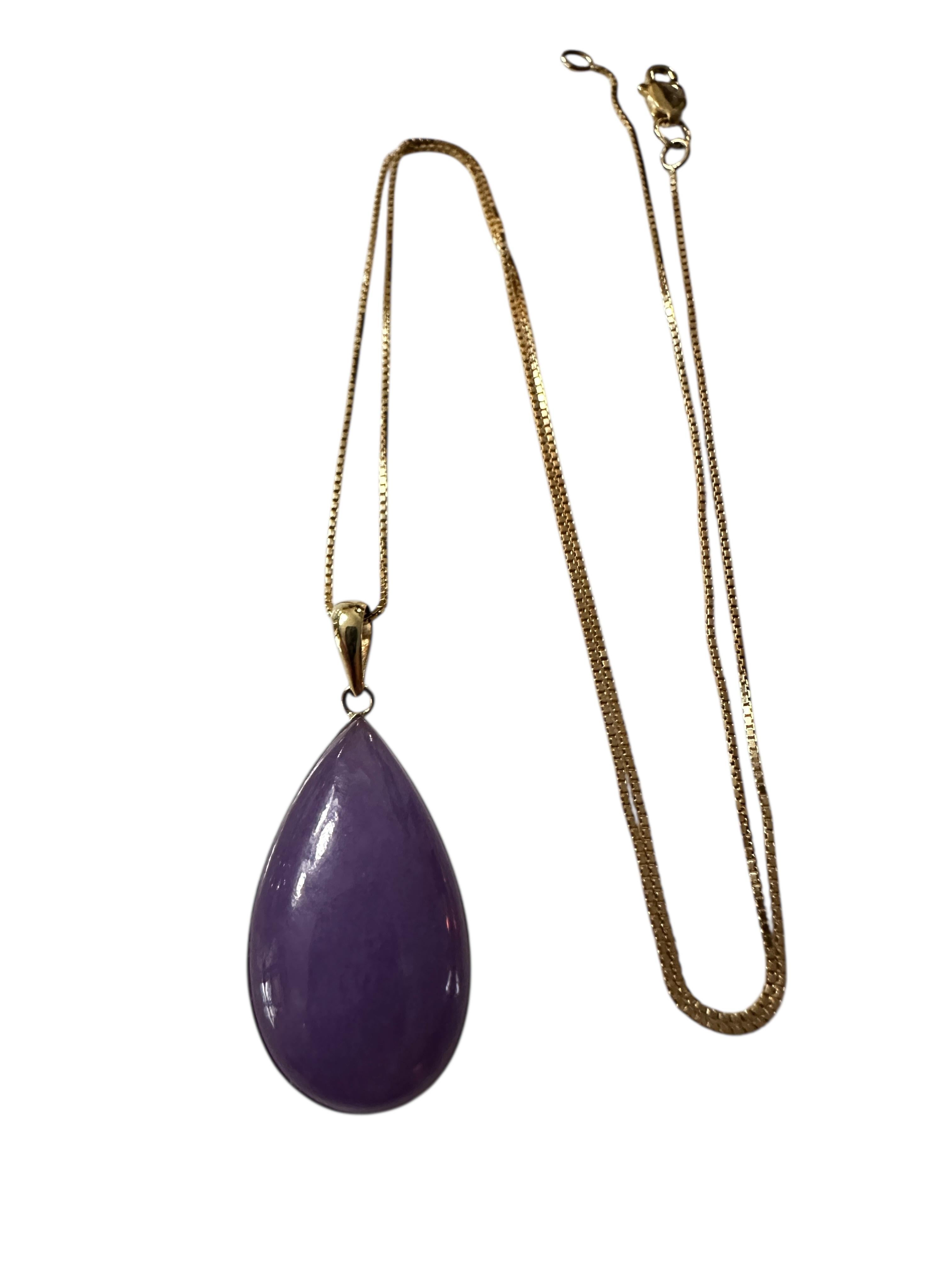 The stone is a Pear cut Amethyst Cabochon and is 6.65 carats. It measures 23.60 mm x 14.38 mm.  It is set in a beautiful 14k yellow gold setting and is stamped 