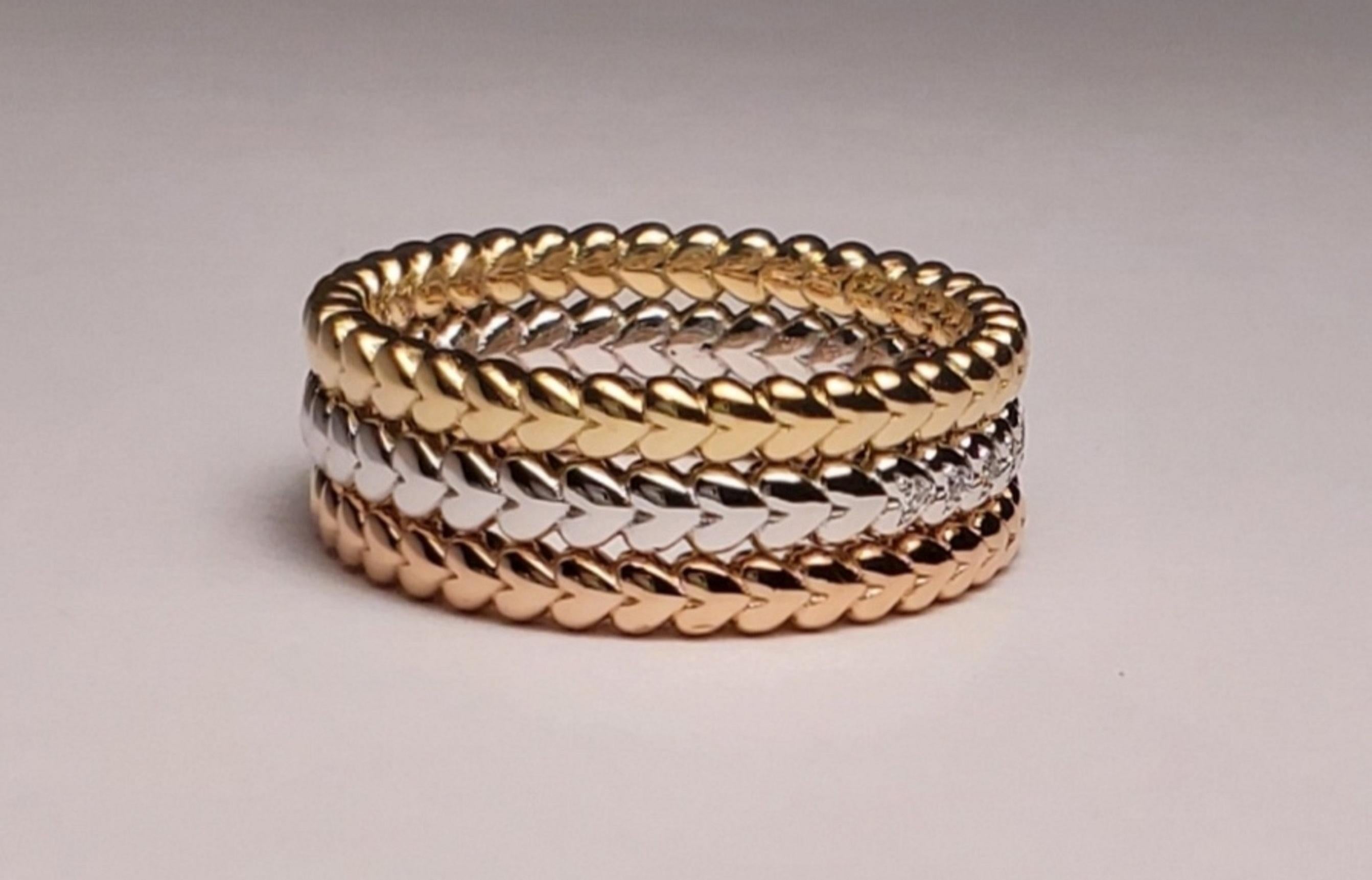Stack able Set of 3 Rings A ring in full rotation 
of Large tapering Hearts with diamonds that
Spiral around with the Flow of Love
stones: 33 round diamonds 
color: G
clarity: VS
weight: .12pts.
gold: 14k
size: 7 (rings can be made to fit your