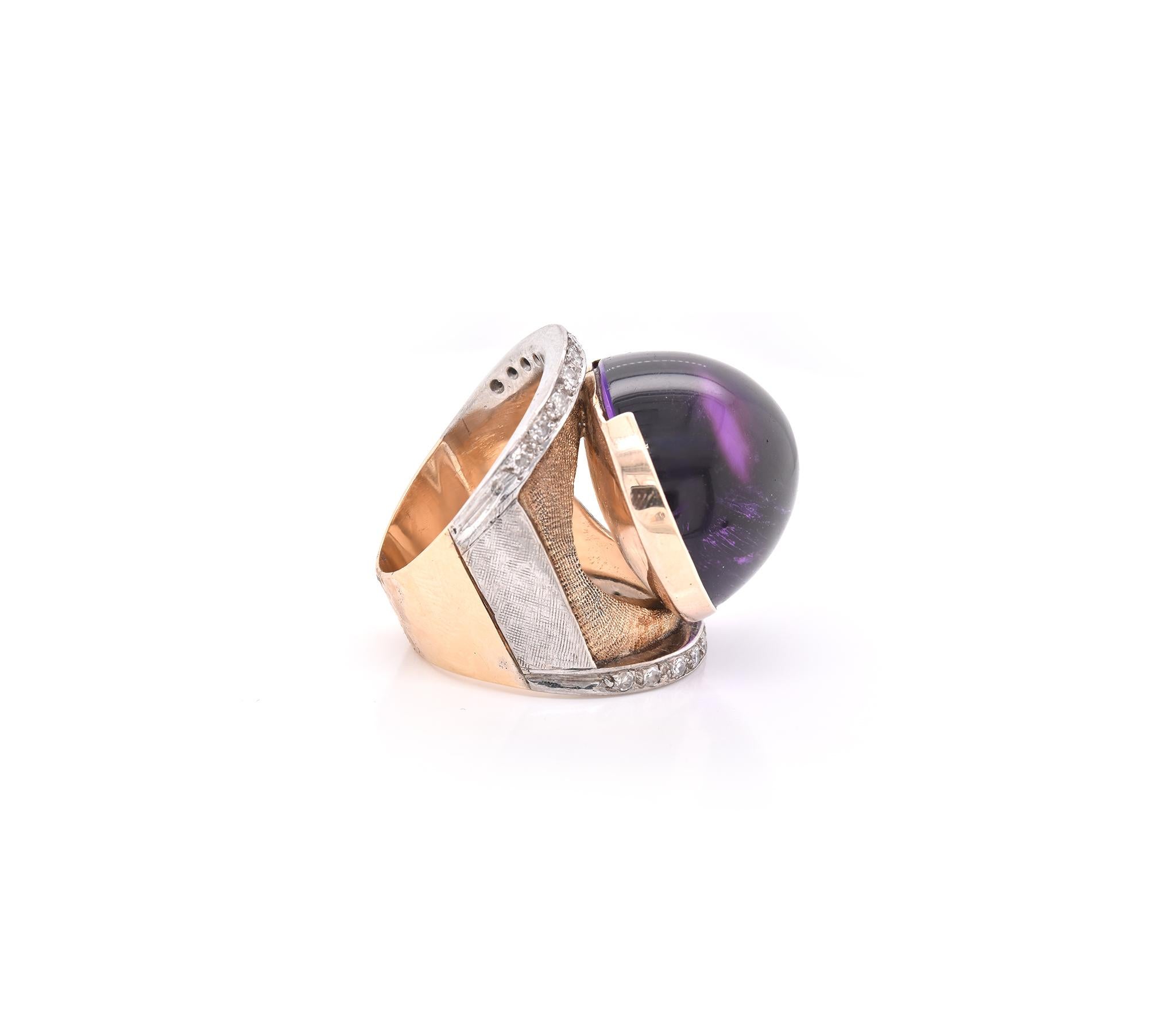 Material: 14k yellow and white gold
Gemstones: Cabochon amethyst = 20.00ct
Diamonds:  22 round brilliant cuts = 0.75cttw
Color: H
Clarity: SI1
Ring Size: 7.75 (please allow two additional shipping days for sizing requests)
Dimensions: ring top