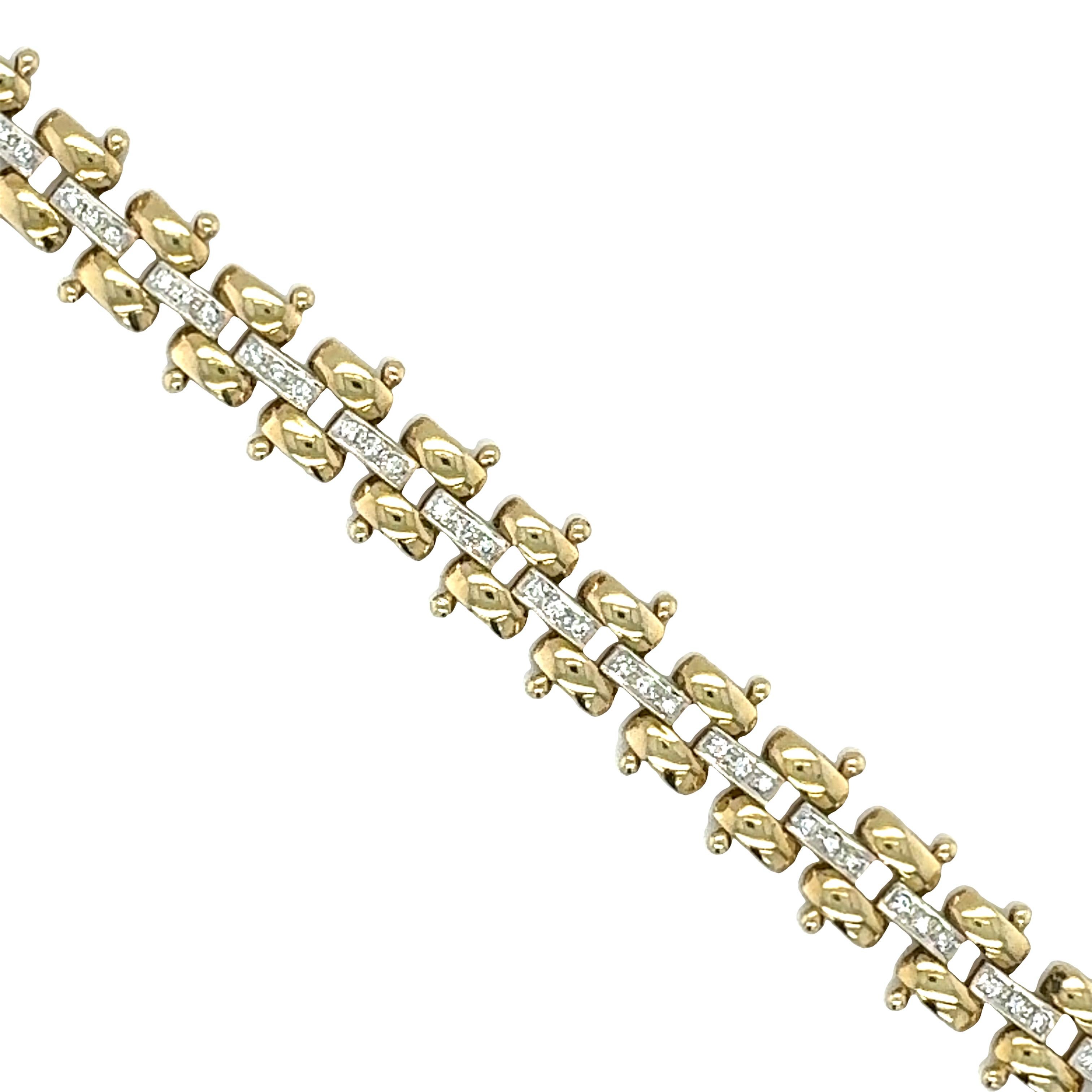 One 14K yellow and white gold diamond link bracelet featuring 60 pave-set, round brilliant cut diamonds totaling 0.94 ct. with I-J color and SI-1 clarity. With safety clasp.

Metal: 14K Yellow and White Gold
Gemstone: Diamonds totaling 0.94 ct., I-J