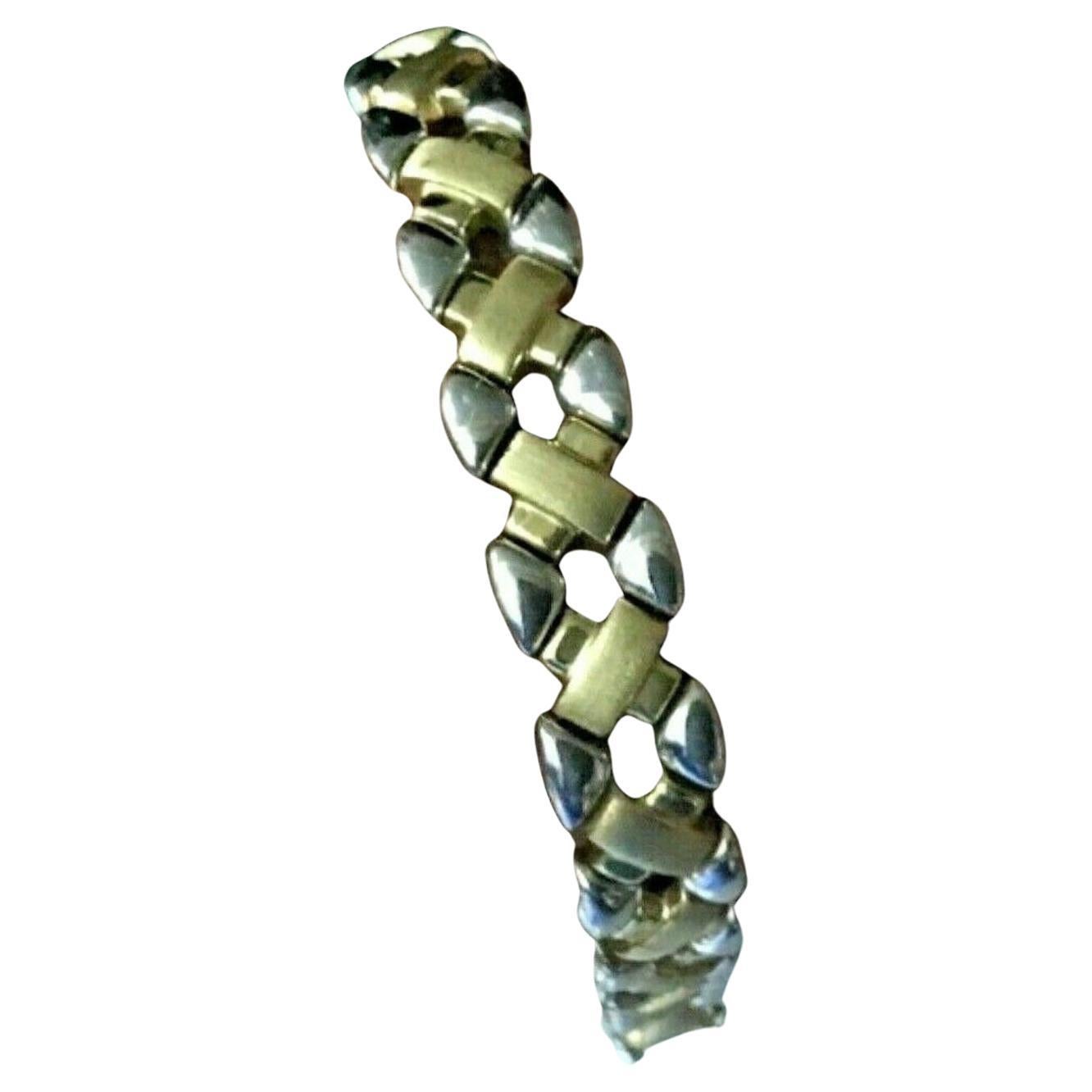 Bracelet en or jaune et blanc 14k. Longueur approximative de 7,75 pouces.
Marqué 14k Italie AURAFIN.