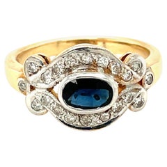 14K Yellow and White Gold Oval Cut Sapphire and Diamond Ring 14K Yellow and White Gold Oval Cut Sapphire and Diamond Ring