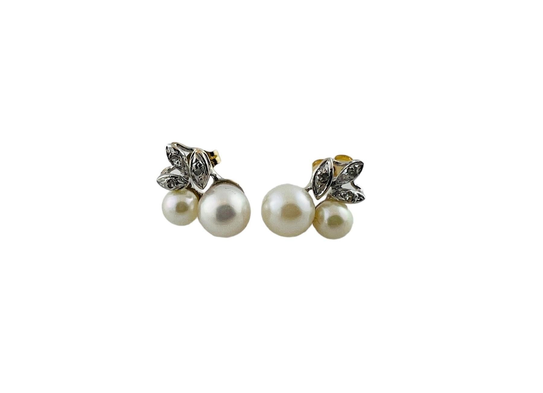 14K Yellow and White Gold Pearl and Diamond Stud Earrings

Each earring features 2 pearls and 3 single cut diamonds. 

Diamond total carat weight approx. 0.06 - Each earring stamped 0.03

Diamonds are set in white gold leaf shapes

Back of earring,