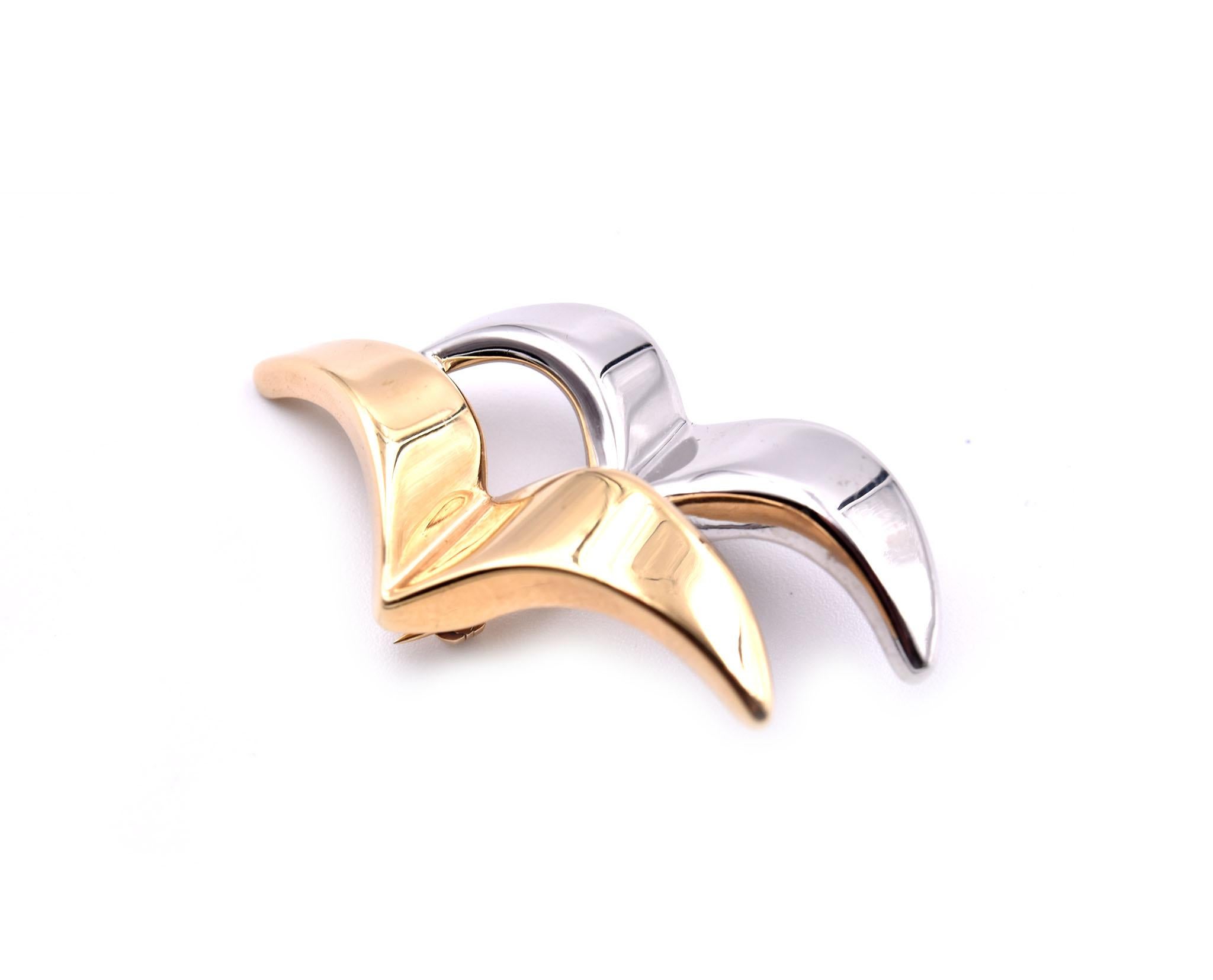 Designer: custom design
Material: 14k yellow and white gold
Dimensions: pin measures 21.50mm long and 41mm wide
Weight: 2.42 grams
