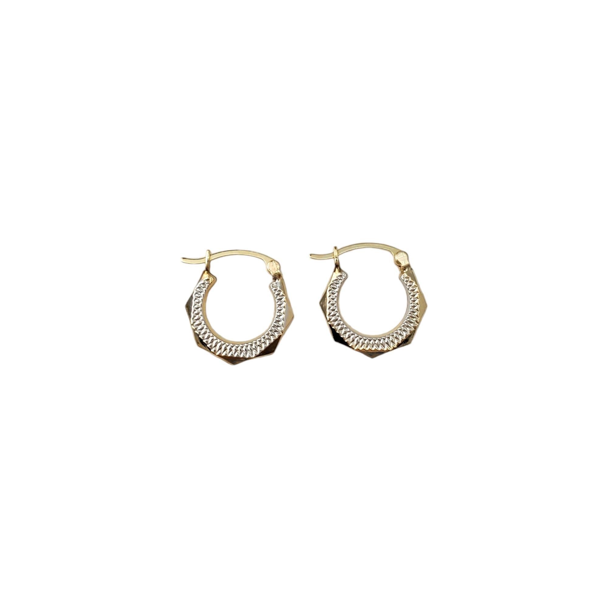 14K Yellow and White Gold Two Tone Hoop Earrings -

These stunning earrings are a classy accessory.

Size:  16.8 mm X 2.3 mm X 3.4 mm

Weight:  0.7 dwt. /  1.1 gr.

Marked: SLC 14K 

Very good condition, professionally polished.

Will come packaged