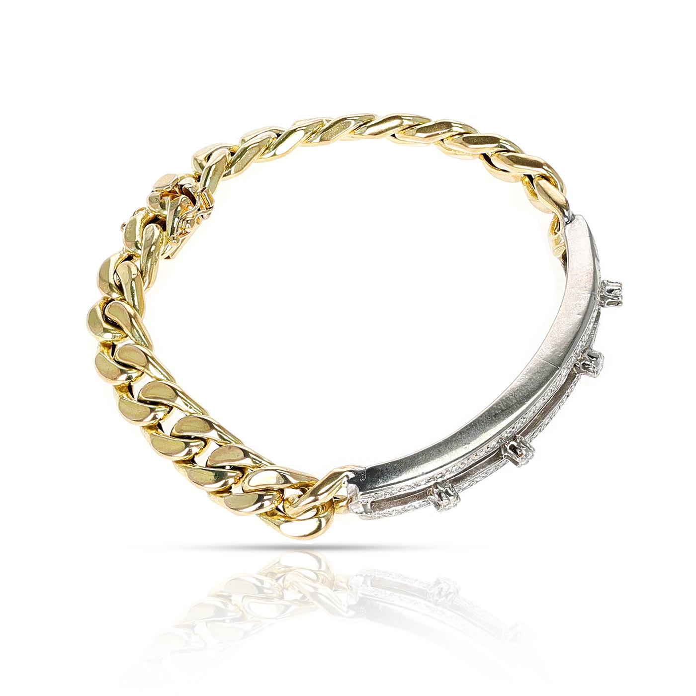 Un bracelet pour homme en or jaune et blanc 14k avec chaîne de diamants. La longueur du bracelet est de 7,50 pouces.  