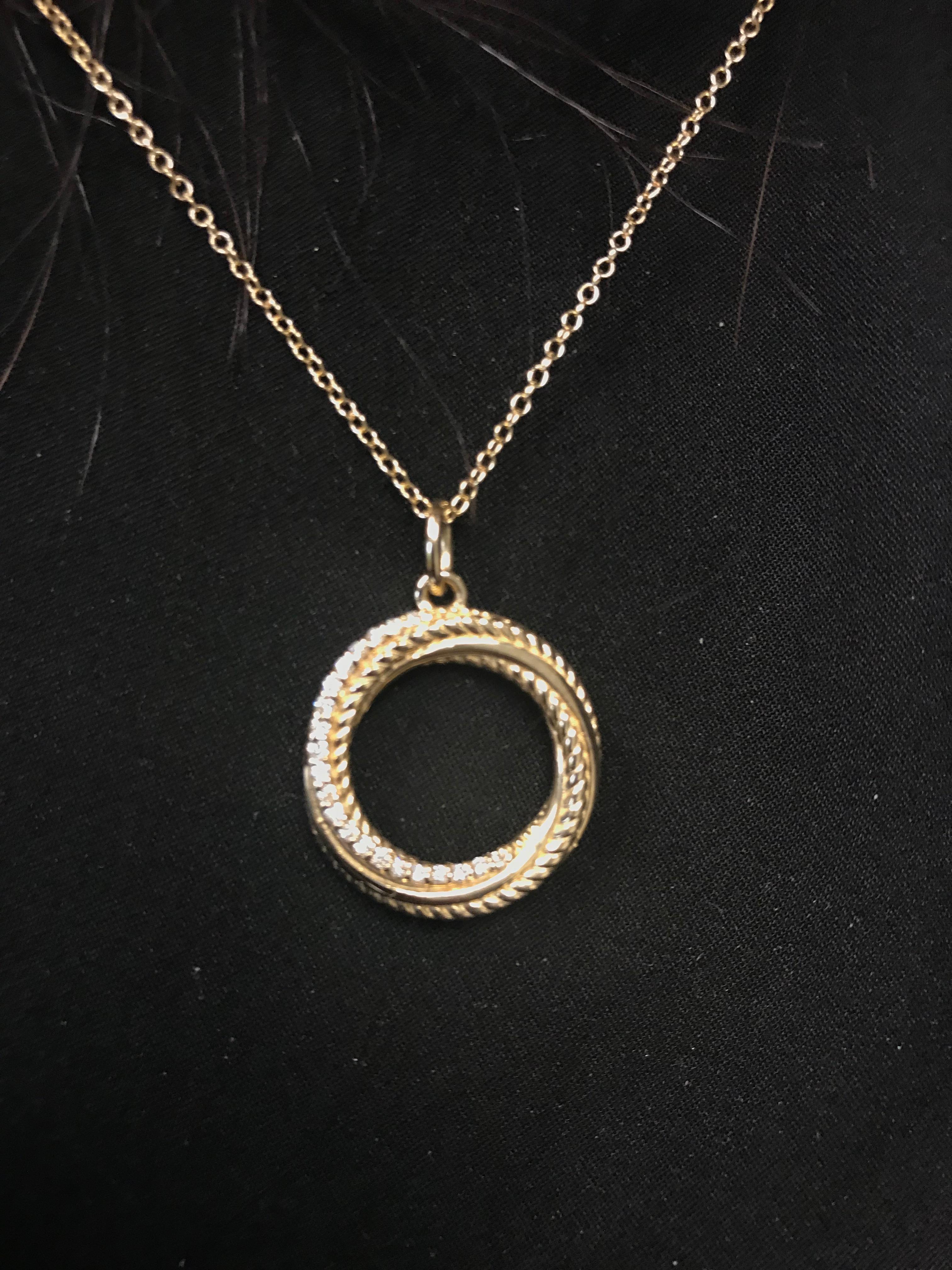 Circle pendant set in 14k yellow gold. The pendant diamond weight is 0.21 carats. The color is G, Clarity is SI1-SI2. This pendant is available in white and rose gold. This pendant has an elegant casual that can be worn in any occasion. 