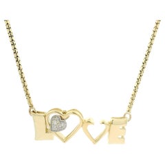 Catena con ciondolo a forma di cuore d'amore in oro giallo 14k da 0,07 ct.