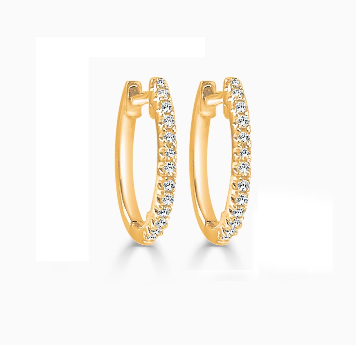 Simple yet stunning, these Diamond huggie hoops are crafted from 14k gold with 13 glittering white 0.09ct of diamonds. Each delicate U-shaped hoop features a single line of white diamonds, pave-set across the face in a gorgeous display. 1/2