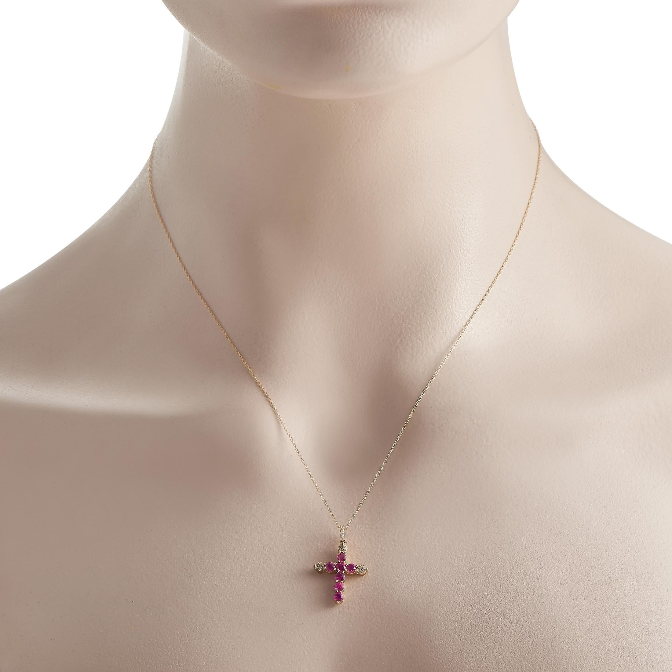 Celebrate your faith with this radiant cross necklace. An piece, the 17-long double-link tace chain and the 1x0.55 pendant are made of 14K yellow gold. The pendant has a scalloped profile bearing seven pink sapphires and clusters of petite