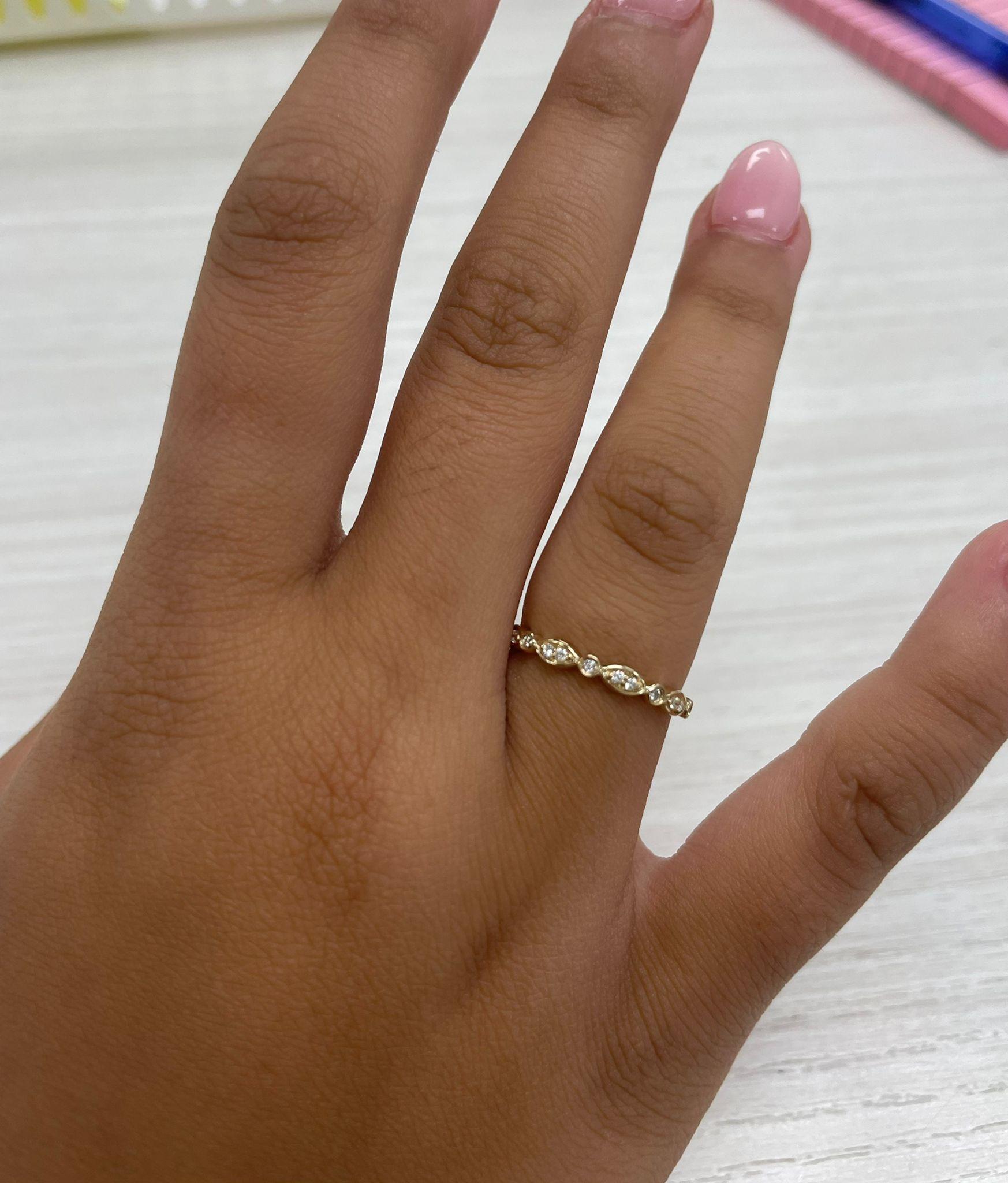 Charming and Elusive Design - This stackable ring features a 14k gold band, and round diamonds approximately 0.10 cts, with a diamond color & clarity of GH-SI1.
 Measurements for ring size: The finger Size of the ring is 6.5 and your jeweler can