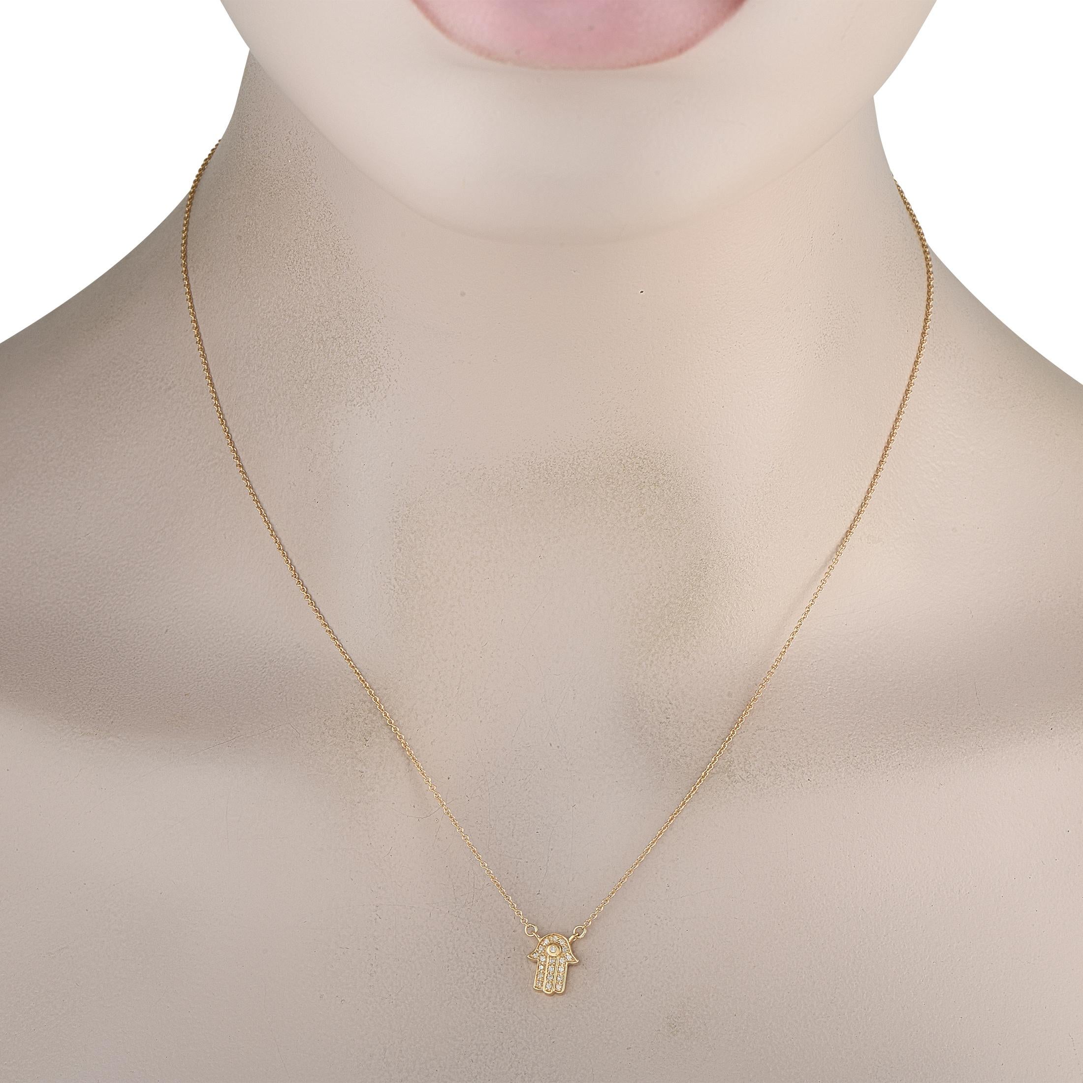 A stylish spiritual symbol makes this 14K Yellow Gold necklace simply unforgettable. Meant to provide good luck and protection to the wearer, the Hamsa pendant measures 0.38 long by 0.25 wide and is suspended from an 18 chain. Diamonds with a total