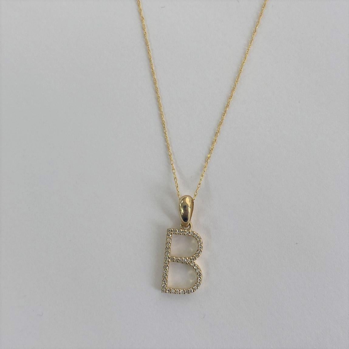 Alphabet Initial Pendant Necklace: Beautiful gold necklace perfectly sized at 16-18 inches in chain length an initial diameter 13mm featuring round diamonds between 0.09 ct - 0.12, allowing you to show off your name, new last name or alma mater.
