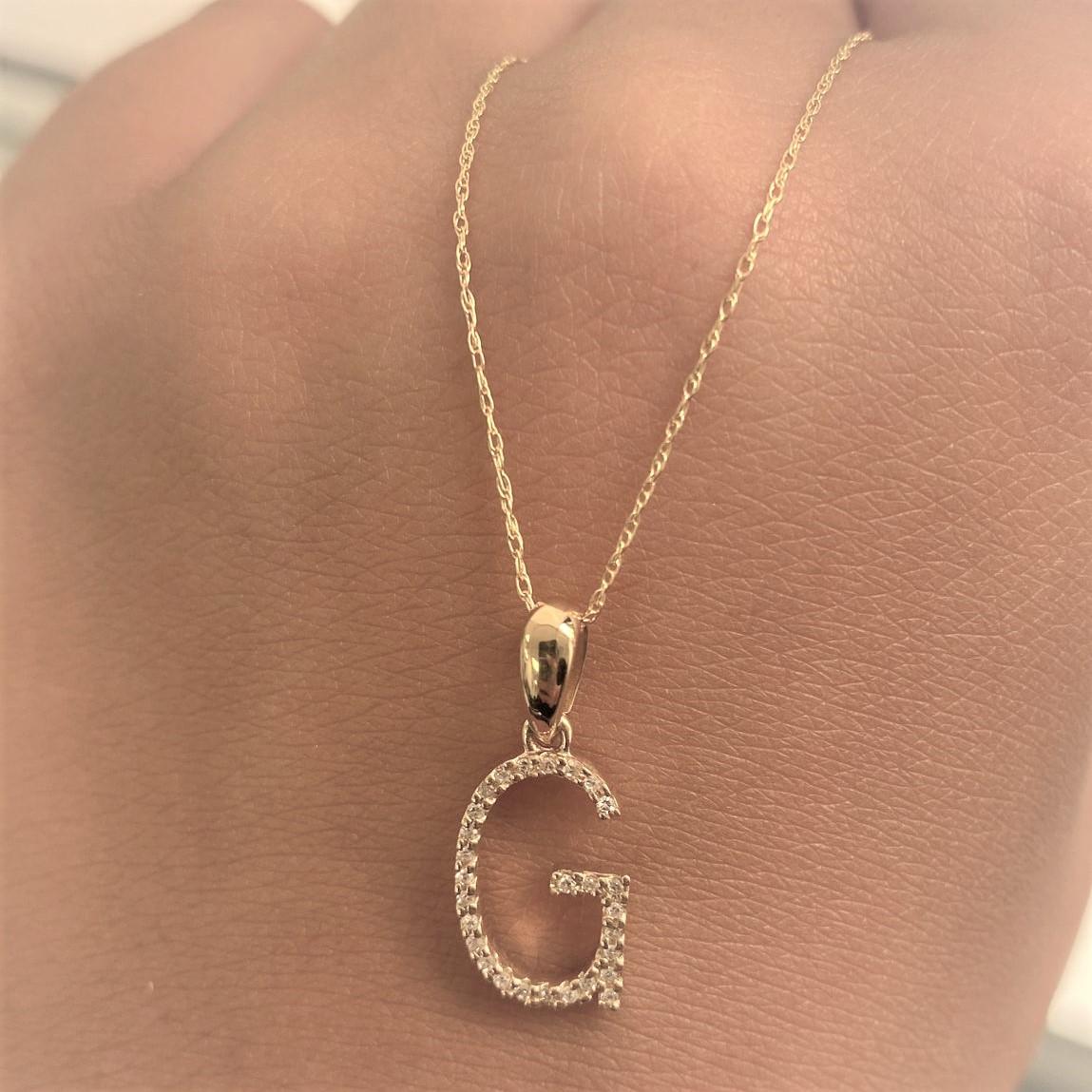 Alphabet Initial Pendant Necklace: Beautiful gold necklace perfectly sized at 16-18 inches in chain length an initial diameter 13mm featuring round diamonds between 0.09 ct - 0.12, allowing you to show off your name, new last name or alma mater.

