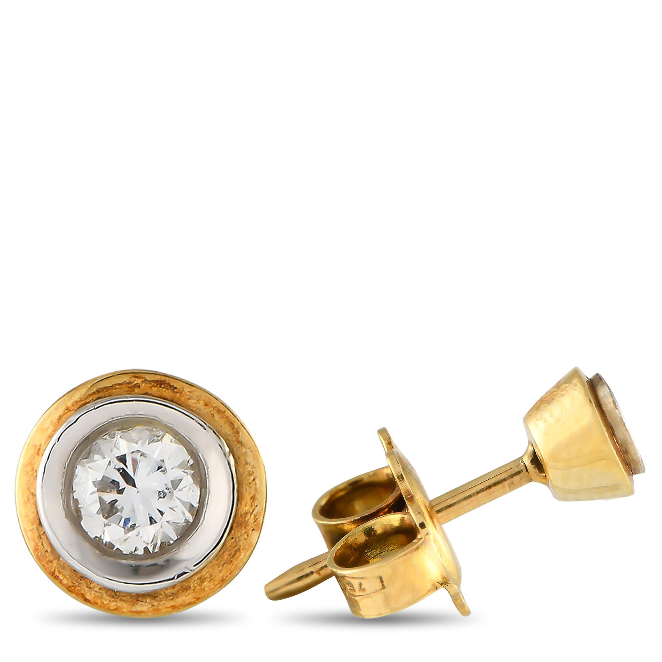 Sparkling round-cut Diamonds totaling 0.12 carats in a classic bezel setting make these stud earrings simply timeless. Each one features a 14K Yellow Gold setting and measures 0.20 round.This jewelry piece is offered in brand new condition and