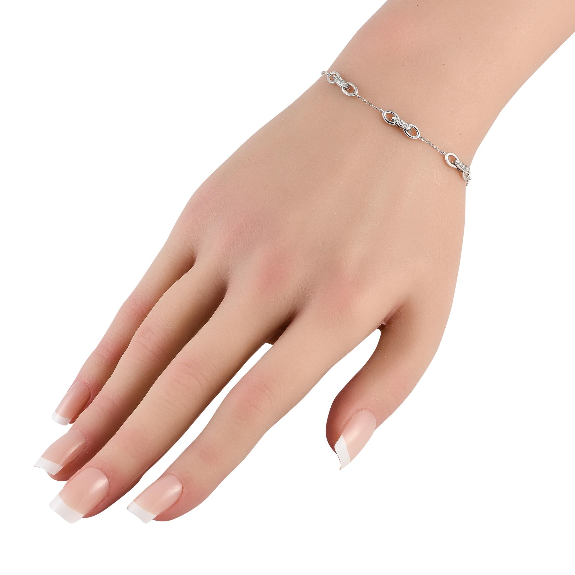 This delicate 14K white gold bracelet is simple, stylish, and statement-making. Ideal for everyday wear, this elegant accessory measures 7.5 long and includes lobster clasp closure. Sparkling diamond accents with a total weight of 0.15 carats