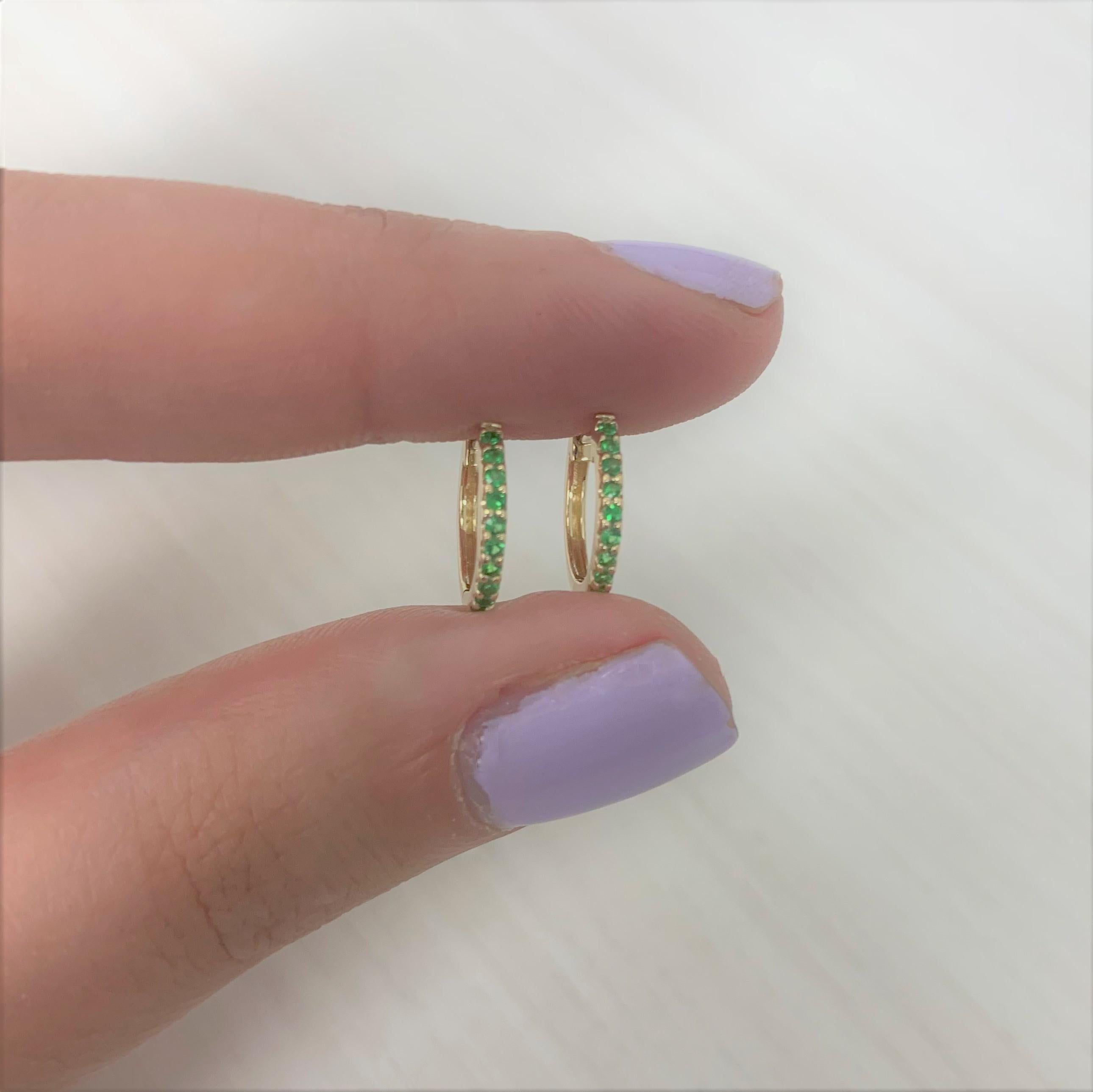 Adorn yourself or gift to a friend these colorful and fun Green Emerald small huggy hoop earrings featuring approximately 0.18 ct. of green emerald. Lever back closure. Super cute for a second piercing.
-14K Yellow Gold
-0.18 ct. Green