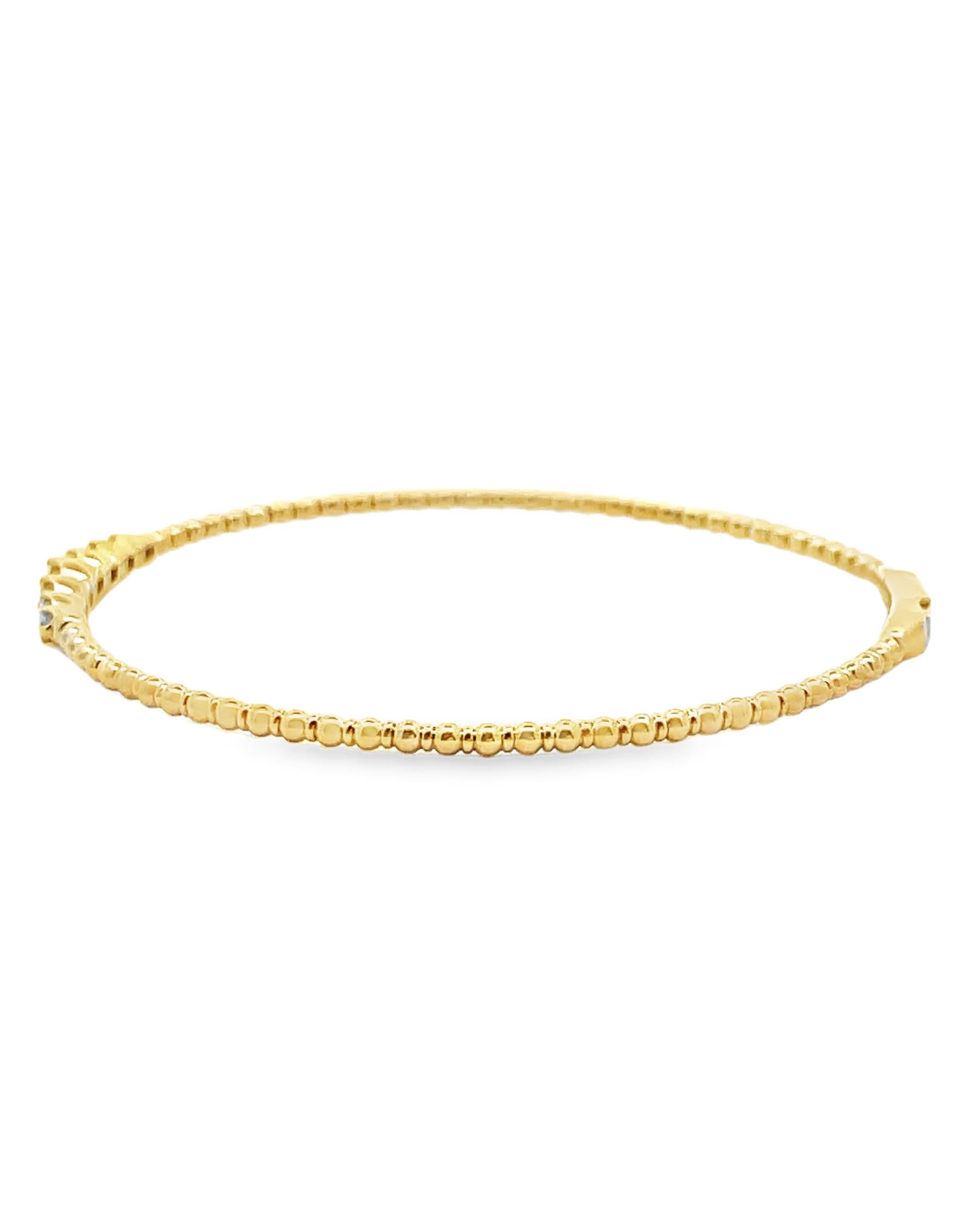 14K yellow gold seven station bangle bracelet with diamonds weighing 0.22 carat total. 

Bangle size is 6.75 inches

Video and pictures are included here; we are happy to provide additional videos or images upon request.  Thank you for viewing our