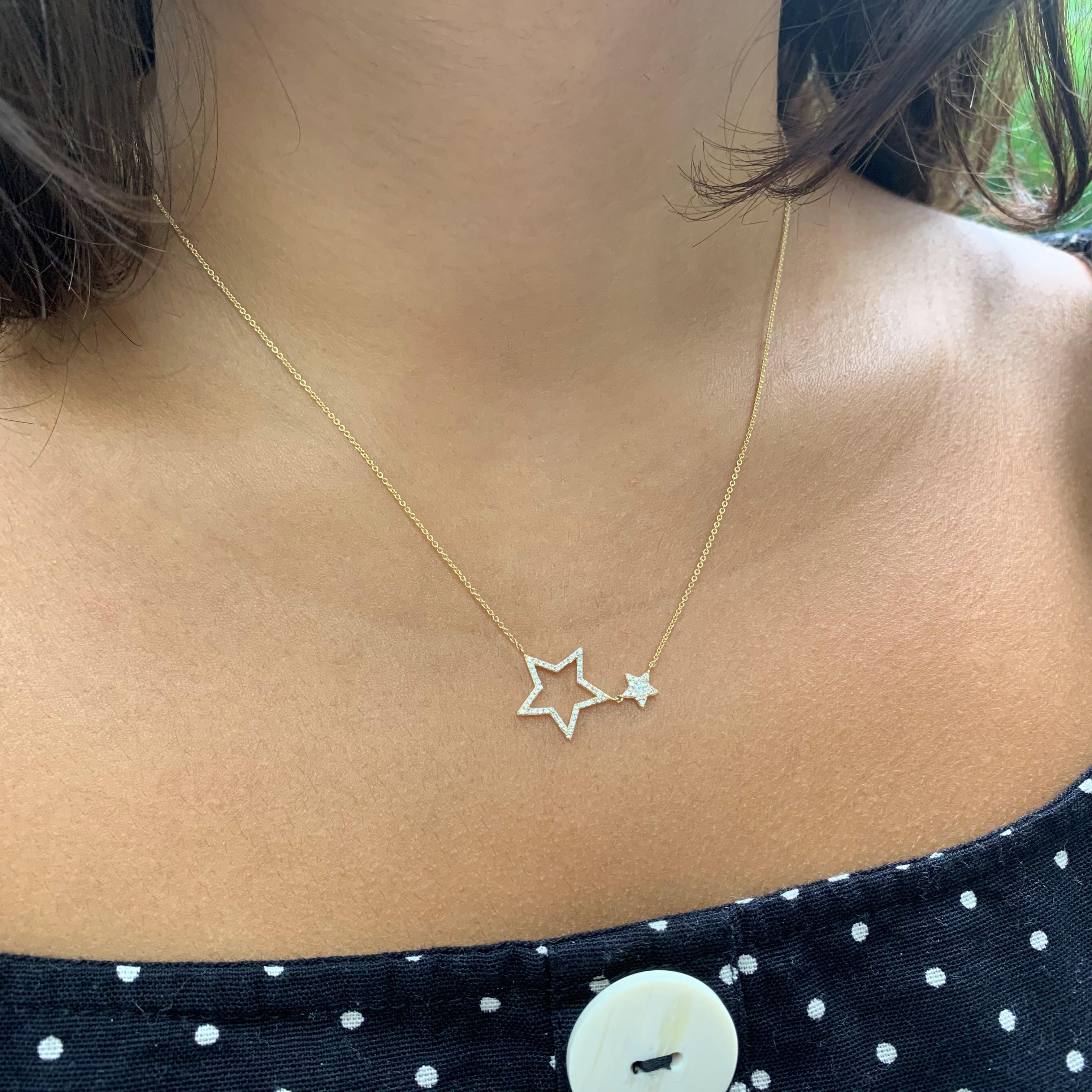Pavé-set diamonds sparkle on 14k gold stars that curve in the center of this bar necklace. The pendant has a total diamond weight of approximately 0.22 carat, and suspends between a rolo chain that adjusts at 15-, 16-, and 18 inches in length. The