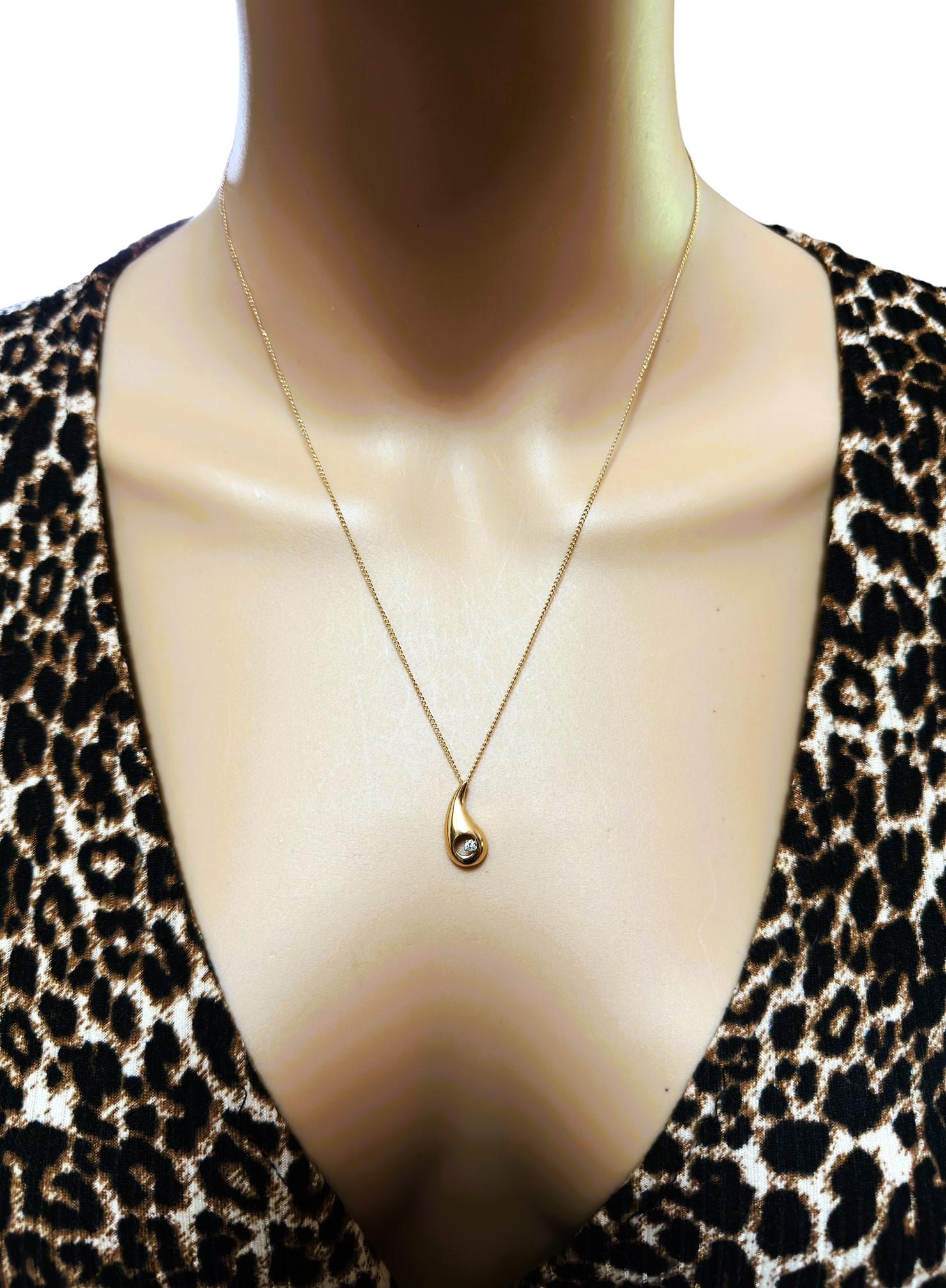 This is a very pretty solitaire pendant!  I just love the teardrop design .  And it's on a beautiful chain measuring 18.5 inches.   It has 1 Brilliant cut diamond placed strategically on the Tear Drop.  The pendant itself is ..63 inches long and