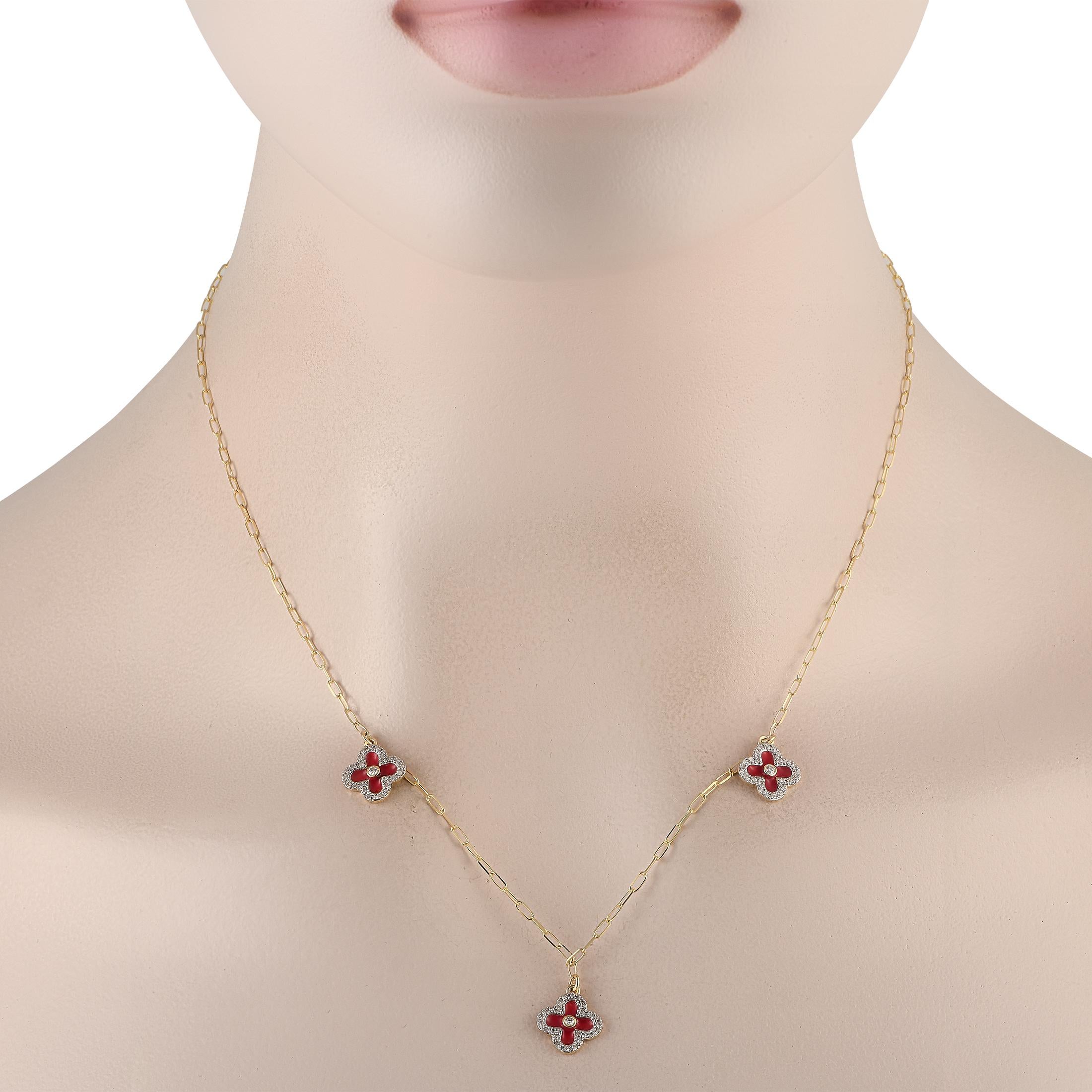 A trio of red clover-shaped motifs sparkle and shine thanks to sparkling Diamonds with a total wight of 0.25 carats on this impeccably crafted necklace. Charming and incredibly elegant in design, each pendant is crafted from 14K Yellow Gold and