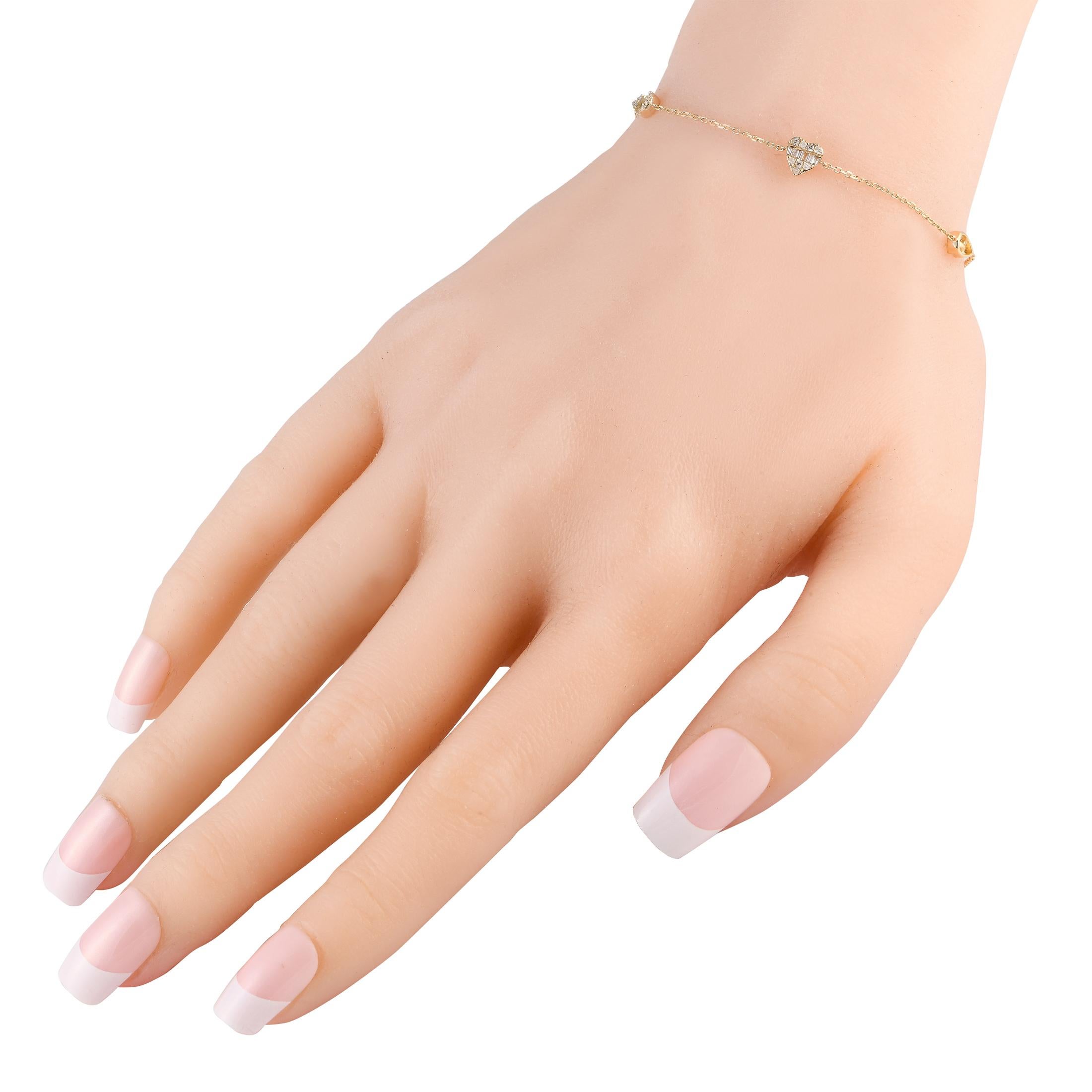 This is an easy, everyday jewel for adding just the perfectly sweet touch of sparkle to your outfits. This bracelet in 14K yellow gold features two pear-shaped bezels and one heart-shaped bezel all adorned with a sparkling blend of round and