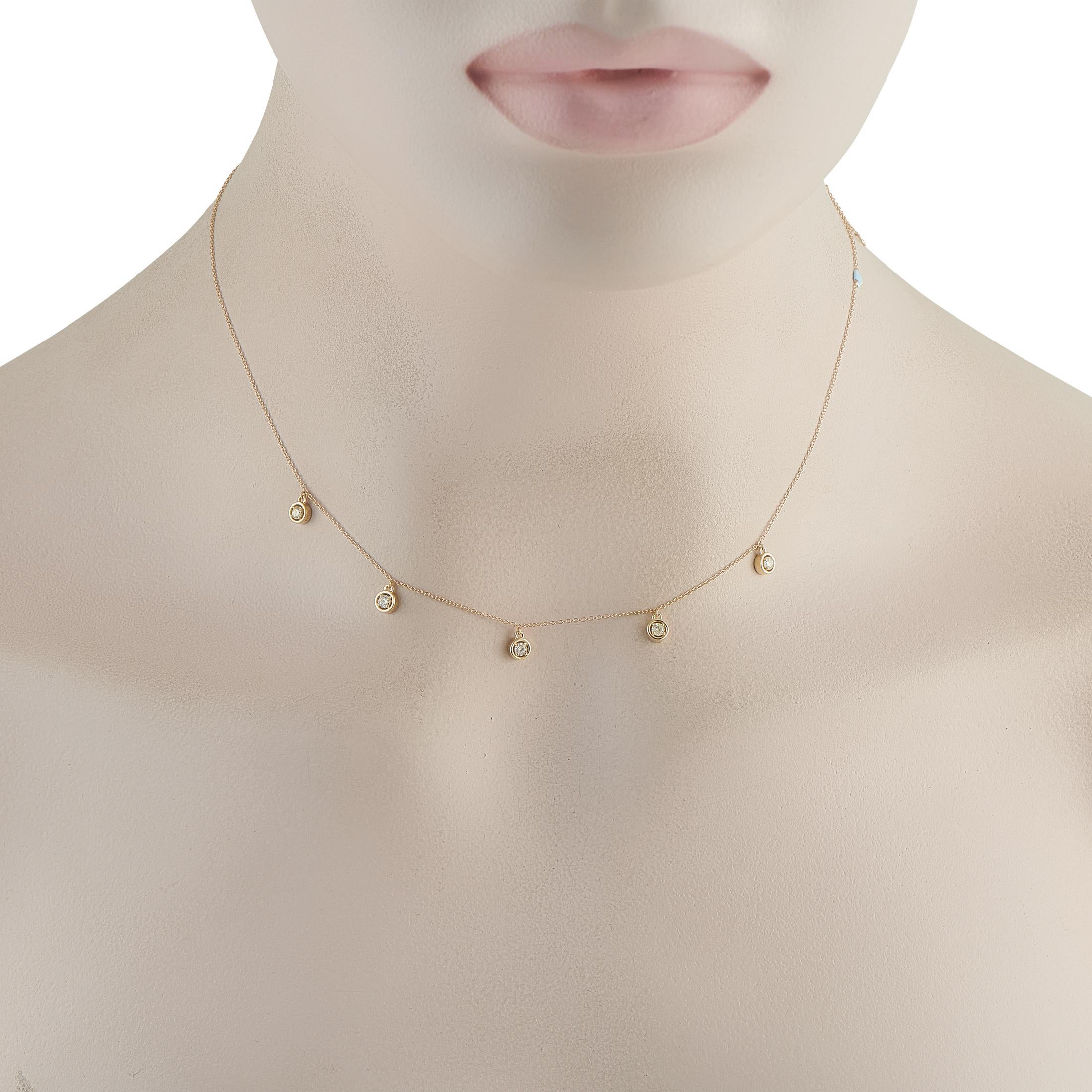 This luxury necklace will put the perfect finishing touch on any ensemble. Set in 14K Yellow Gold, Diamonds totaling 0.25 carats are gracefully suspended from a delicate 18 chain.This jewelry piece is offered in brand new condition and includes a