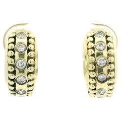 Orecchini a cerchio Huggie in oro giallo 14k con diamanti da 0,30 ct.