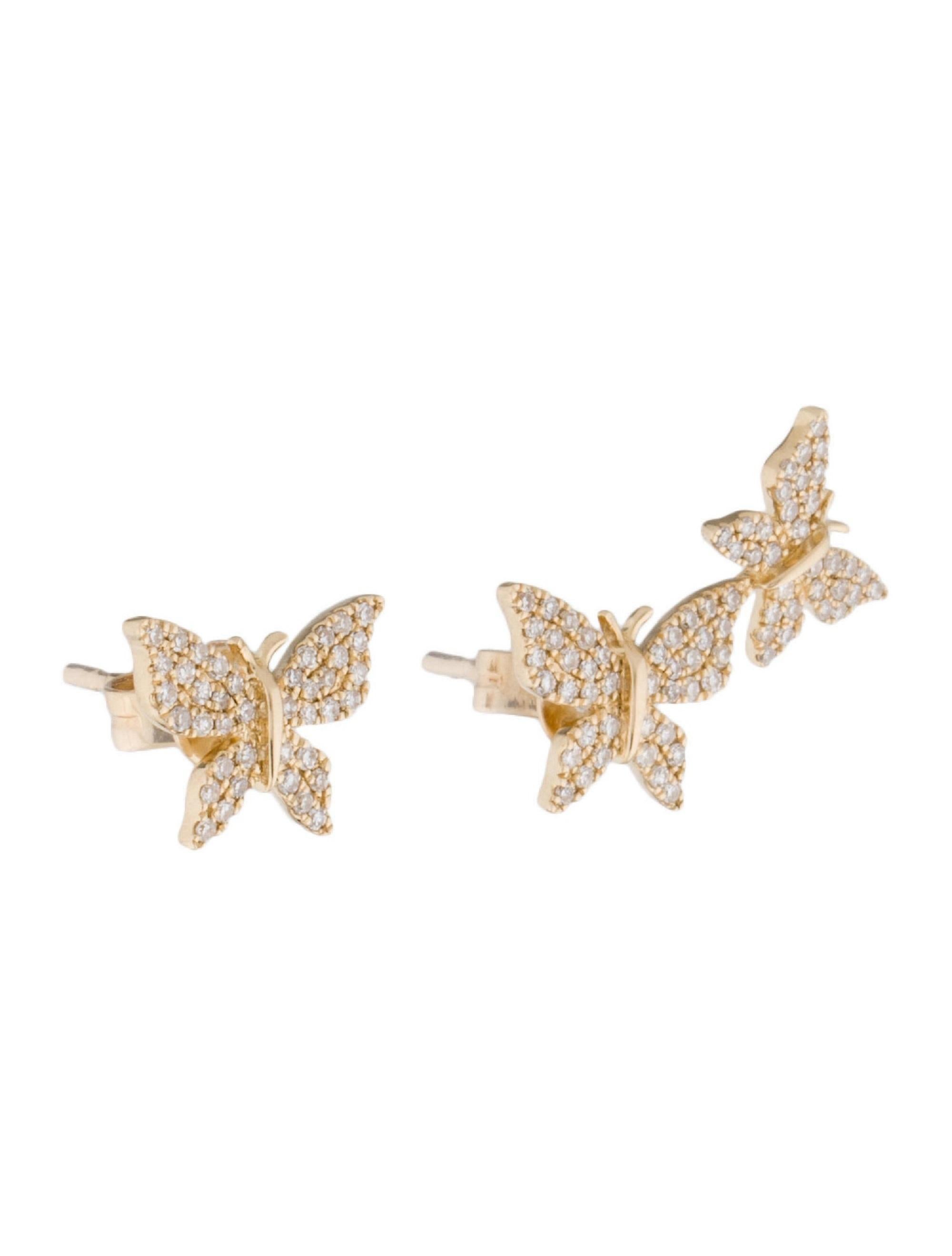 These trendy and sweet Mismatched Butterfly Earrings crafted of 14k gold and round diamonds create an illusion of a second ear piercing although its just an ear climber on one side! Featuring approximately 0.35ct of diamonds GH-SI color and clarity.