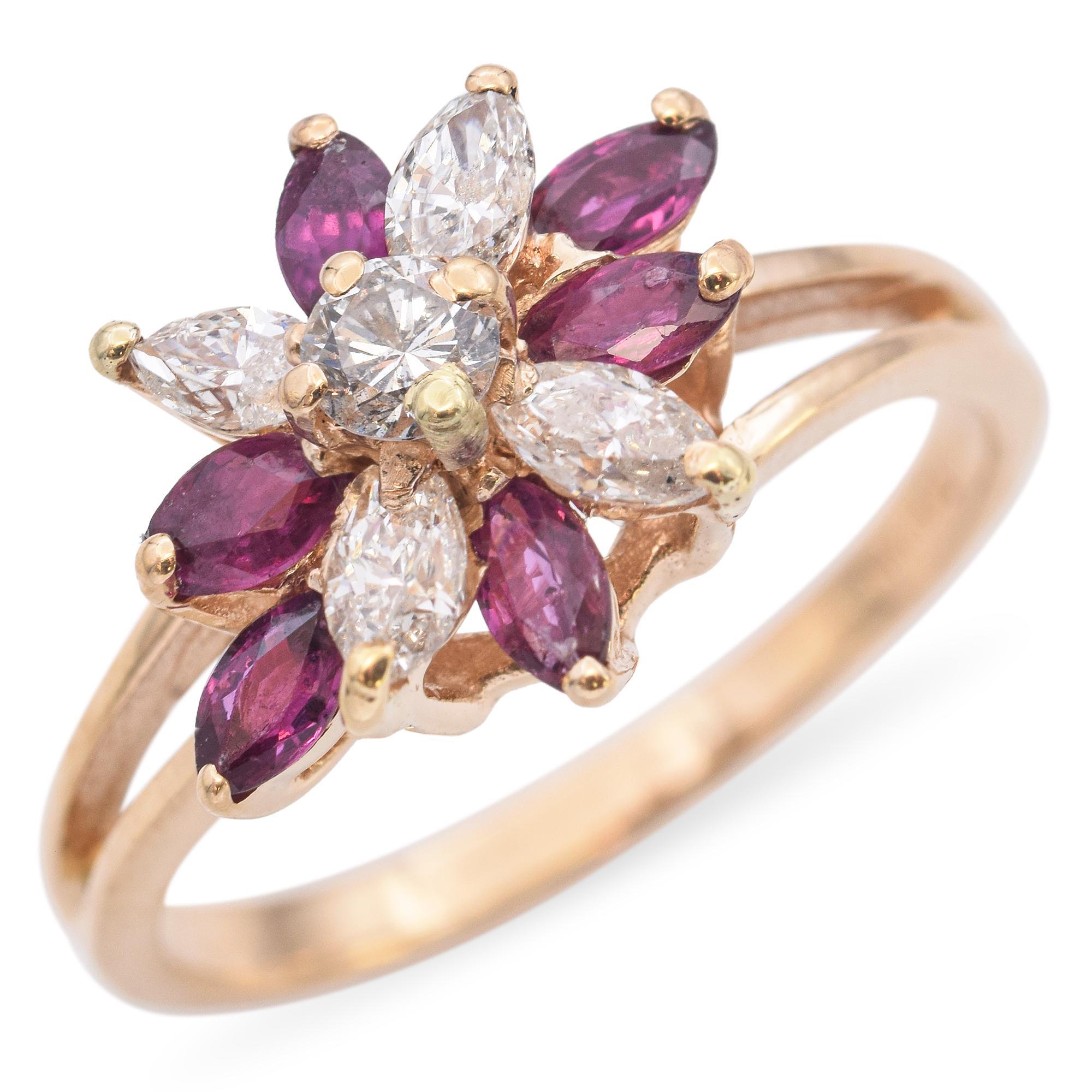 Cette élégante bague est réalisée en or jaune 14 carats. Whiting présente des rubis taille marquise d'un rouge éclatant, complétés par des diamants d'un blanc éclatant. Les rubis et les diamants sont disposés en grappes florales. Cette pièce