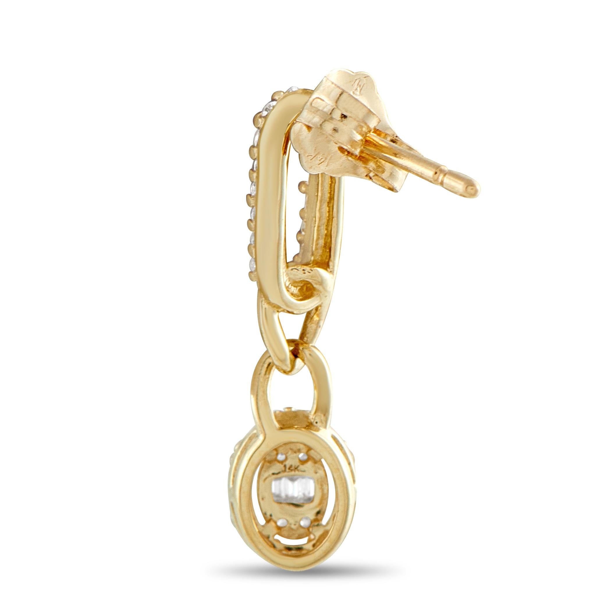 These drop earrings explore shape and structure in a modern way. A slender paperclip link set with diamonds leads to two polished, interlocked curb links, guiding the eye to a glittering oval drop. The drop centers a short line of baguette diamonds,