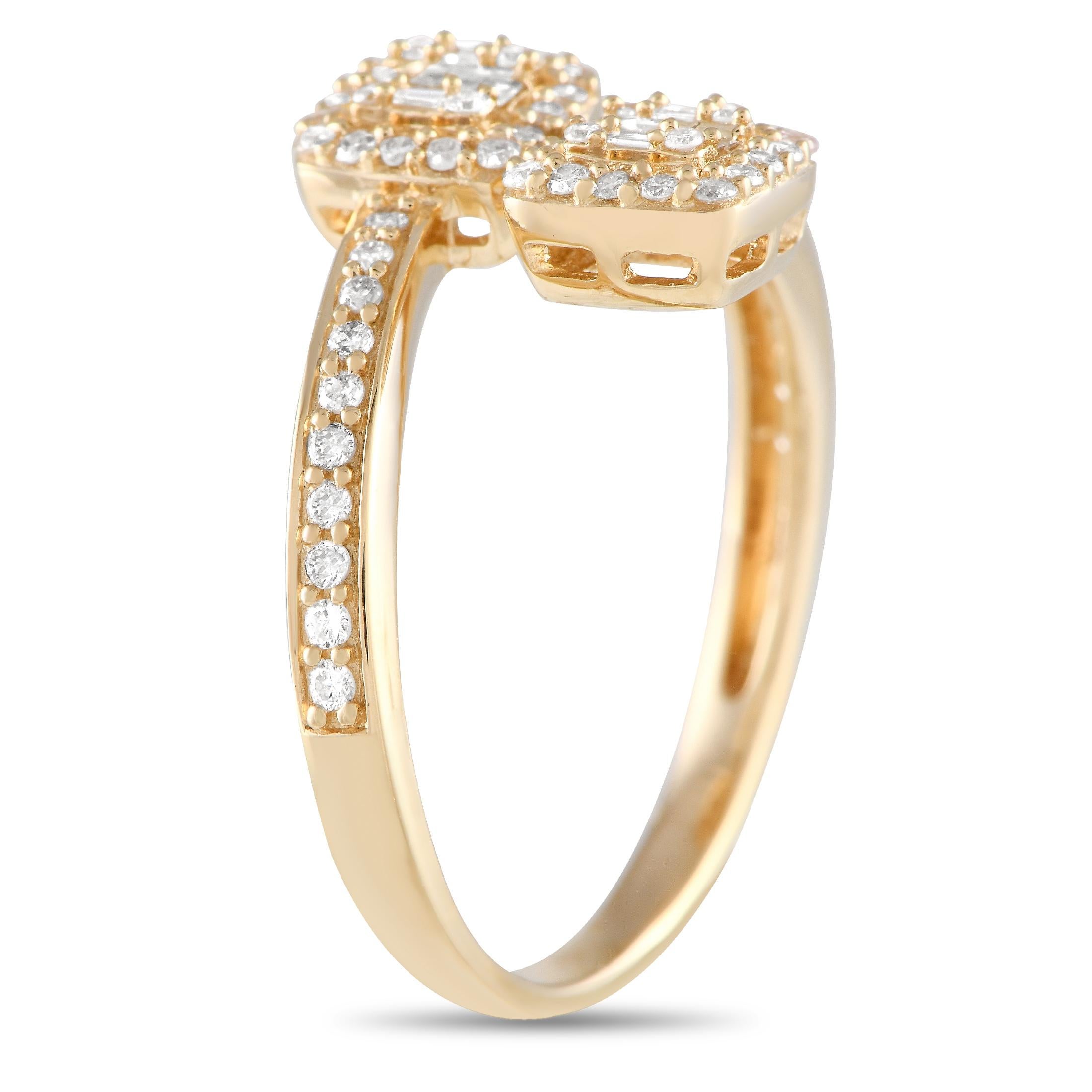 Looking for something unexpected and utterly charming? Take a look at this bypass ring. It is rendered in 14K yellow gold, with a slim shank with diamond-traced shoulders. The two ends of the bypass shank are detailed with a square-shaped cluster of