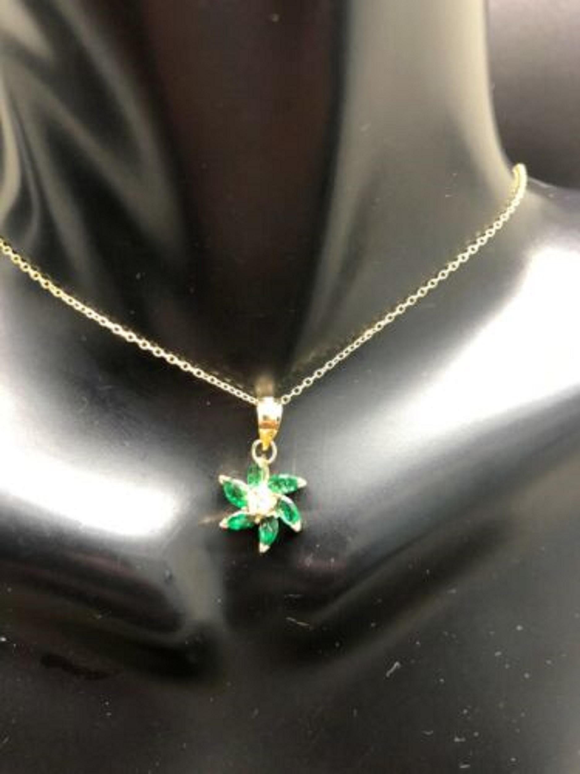 Up for sale:

This absolutely stunning solid 14k yellow gold emerald  marquise cut with round cut natural diamond accent flower pendant chain necklace. The necklace is featuring a stunning 0.50 carat emeralds and diamond accent; G color; VS clarity;