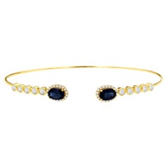 Bracciale in oro giallo 14k con diamante tondo brillante da 0,53 carati e zaffiro da 1,30 carati