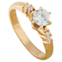 Bague en or jaune 14 carats sertie d'un diamant de 0,58 ct MF11-070226