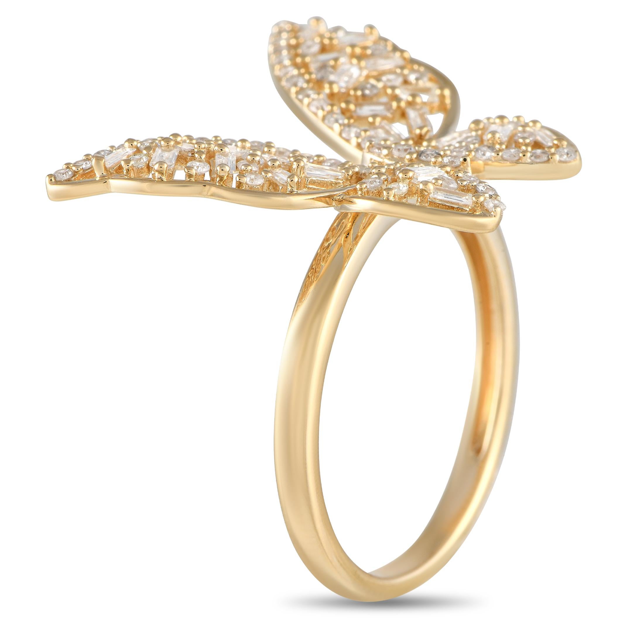 This sparkler will easily find its place in a fun-loving wardrobe. The ring has a delicate yellow gold band measuring only 1mm thick. It is topped with a sculpted butterfly designed with a diamond-dotted marquise bezel as its body and a combination