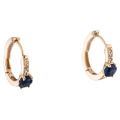 14K Yellow Gold 0.64ctw Sapphire 
0.10ctw Diamond Huggie Earrings