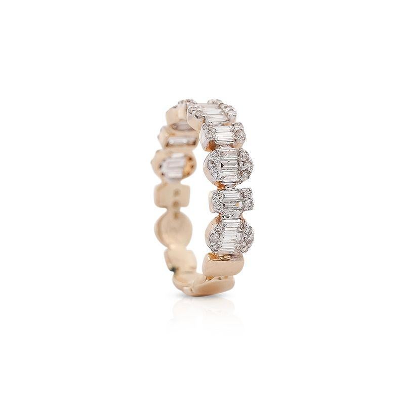 This is a 14K Yellow Gold Multi-Shape Geometric Diamond Band Ring. This ring features 0.74 carats total weight of round and baguette cut diamonds. The diamonds are graded F-G in color and VS1-VS2 for clarity.
The unique design of this band ring
